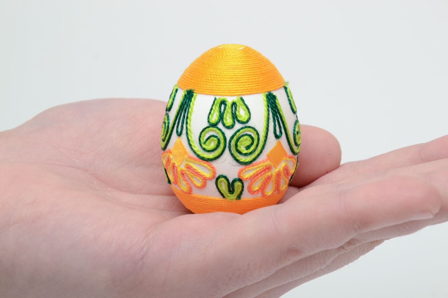 Handmade Easter egg decorated with yellow threads photo 5