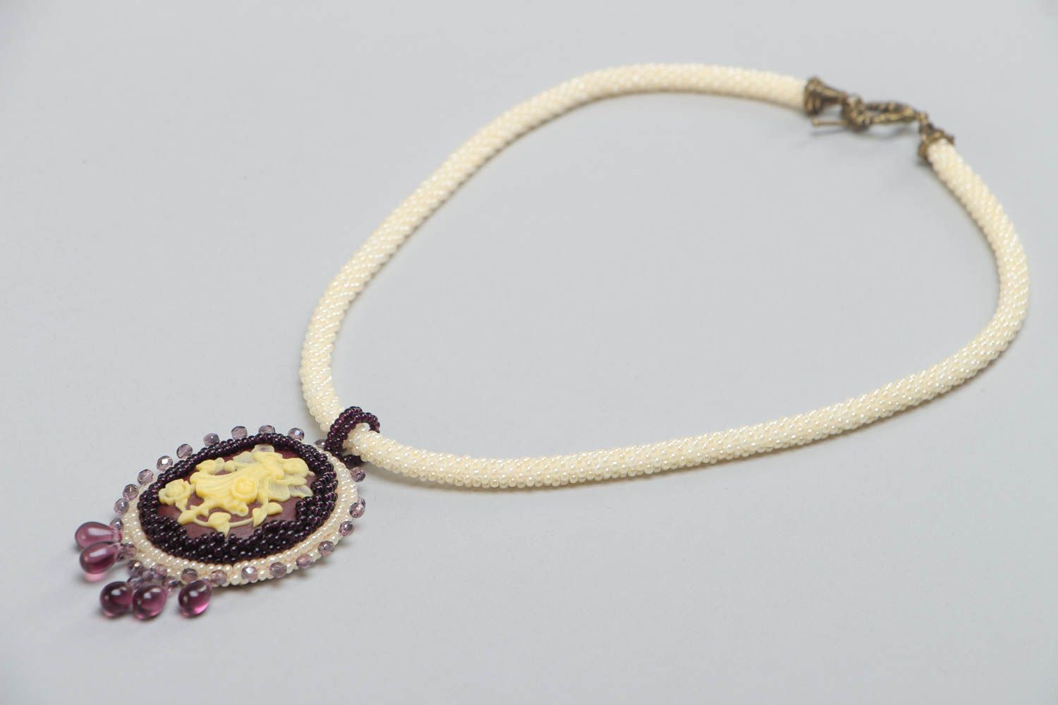 Light oval handmade unusual beaded pendant for women photo 4