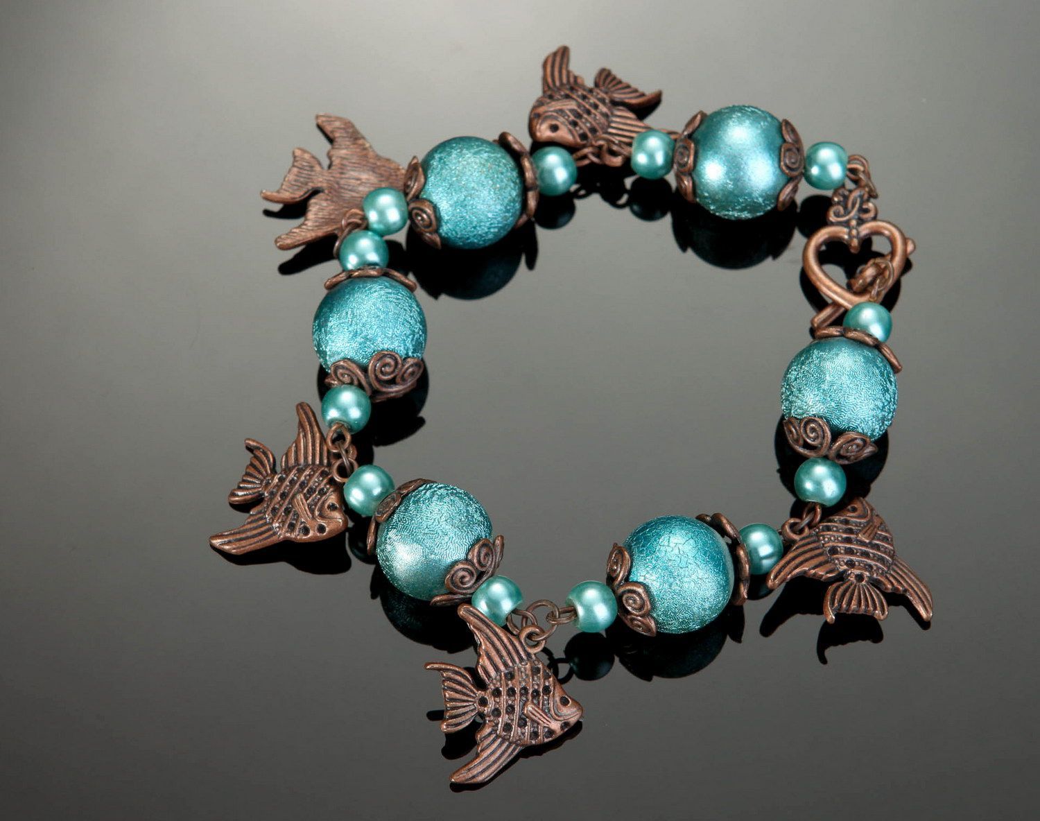Ceramic pearls bracelet with fishes photo 1