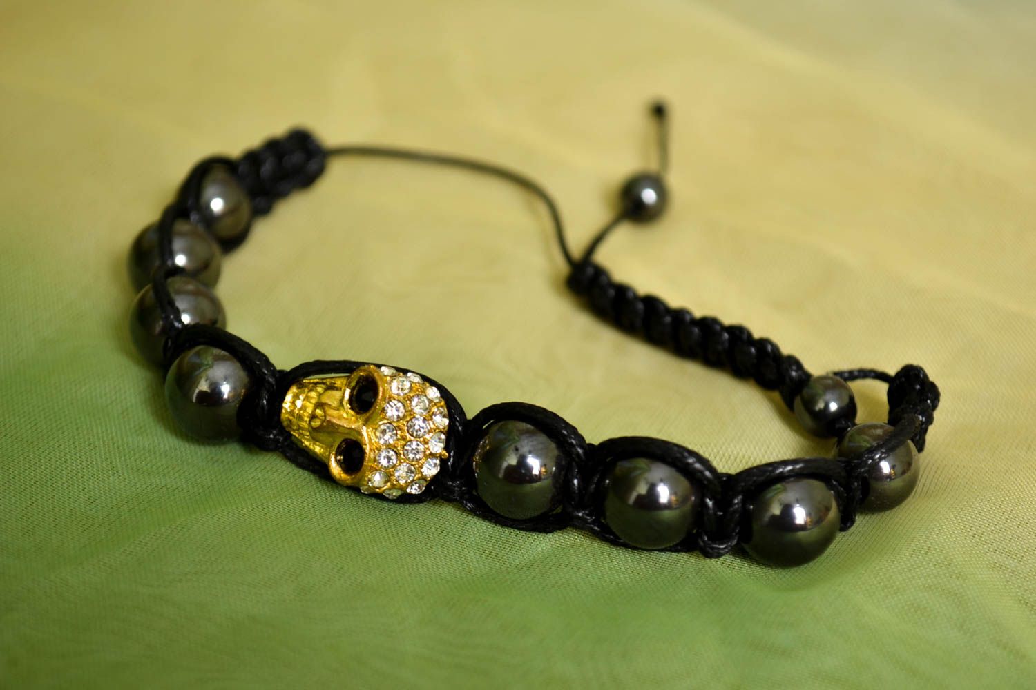 Strand black beads on black cord unisex bracelet with scull centerpiece photo 2
