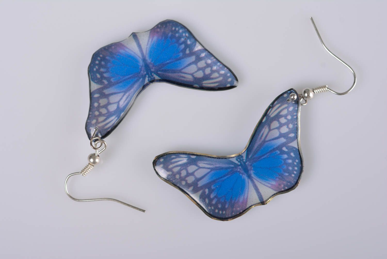 Handmade elegant designer dangling earrings blue butterflies in epoxy resin photo 4