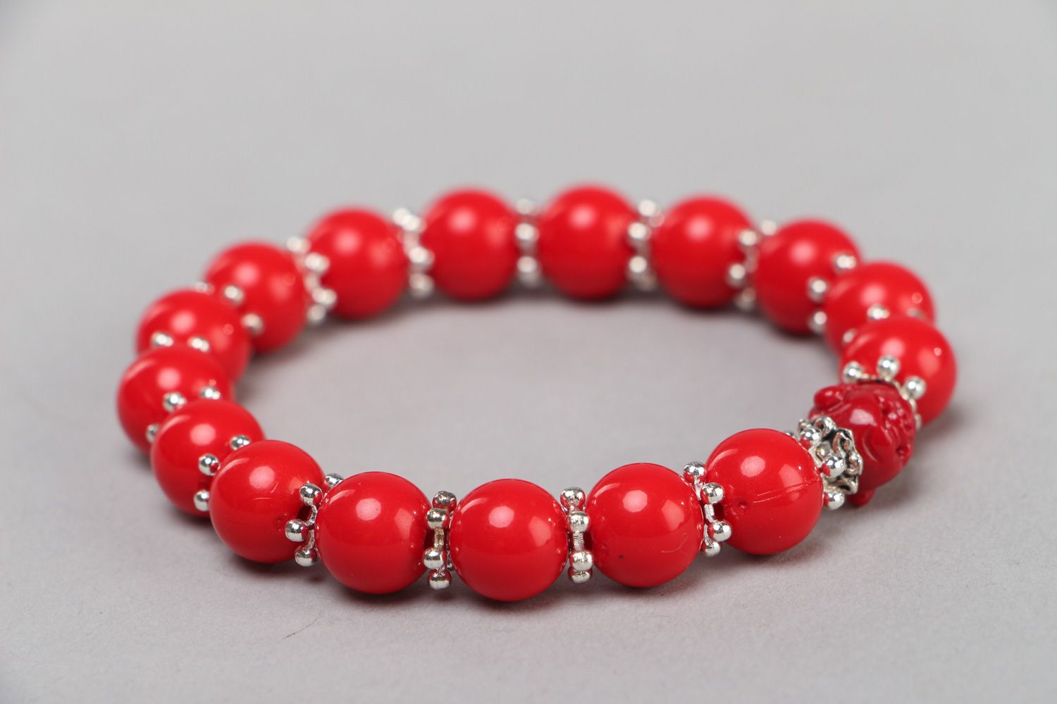 Handmade laconic stretch wrist bracelet with plastic beads of red color for women photo 1