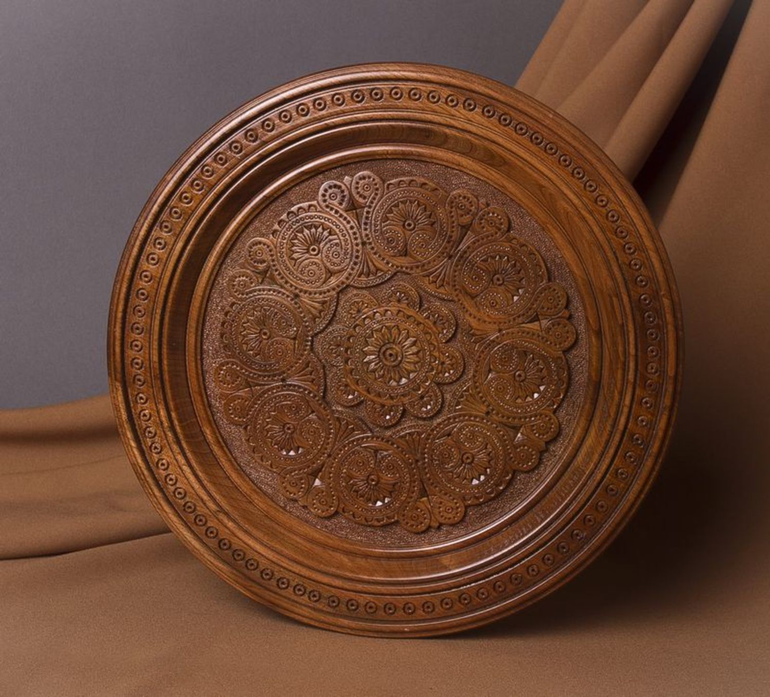 Decorative wooden plate with carving photo 1