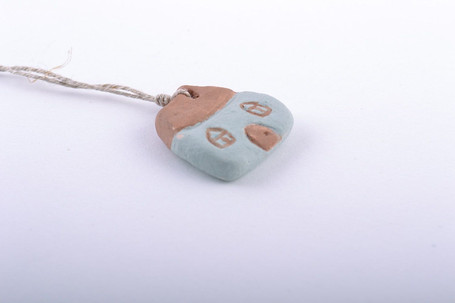 Unusual design handmade clay pendant in the shape of house painted with engobes photo 4