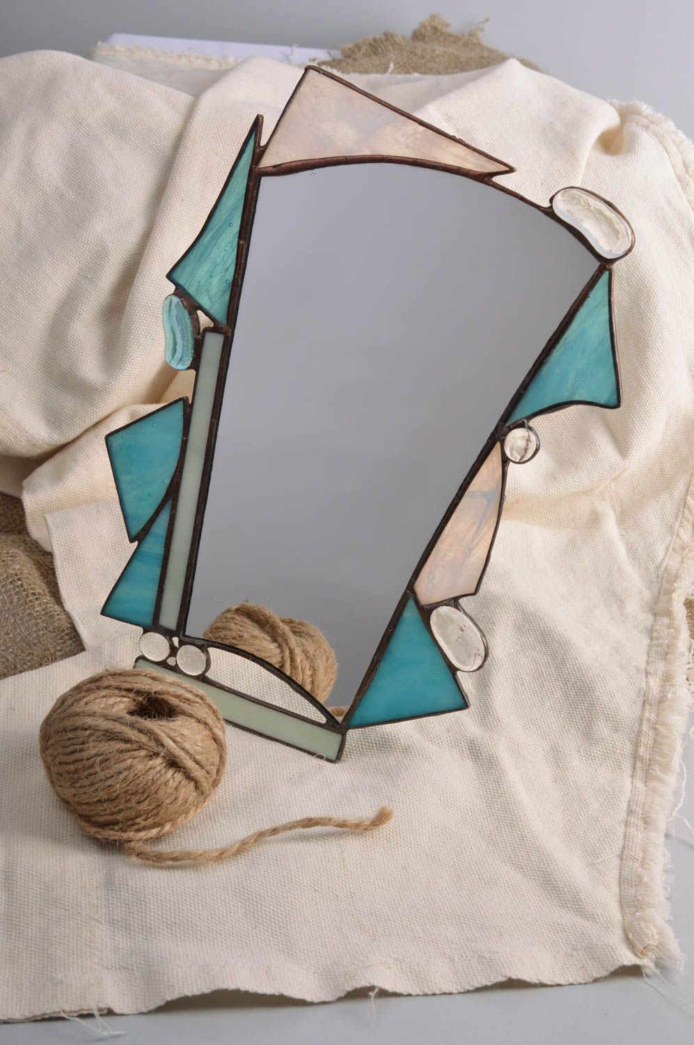 Handmade small table mirror of unusual shape in stained glass frame photo 1