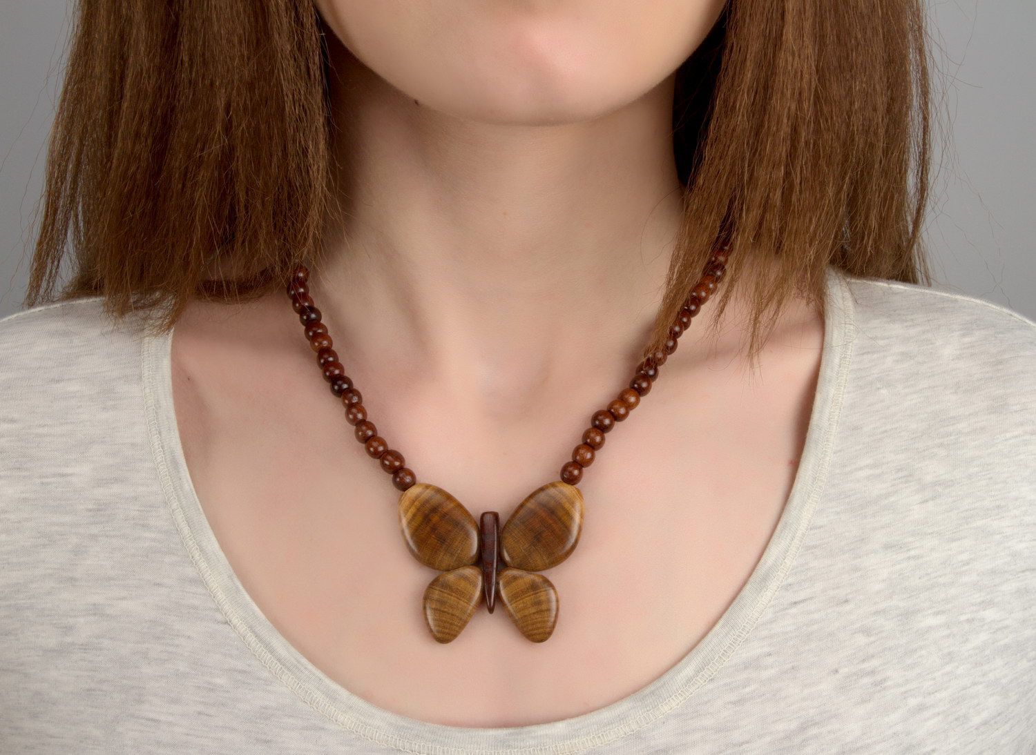 Wooden bead necklace with butterfly photo 4