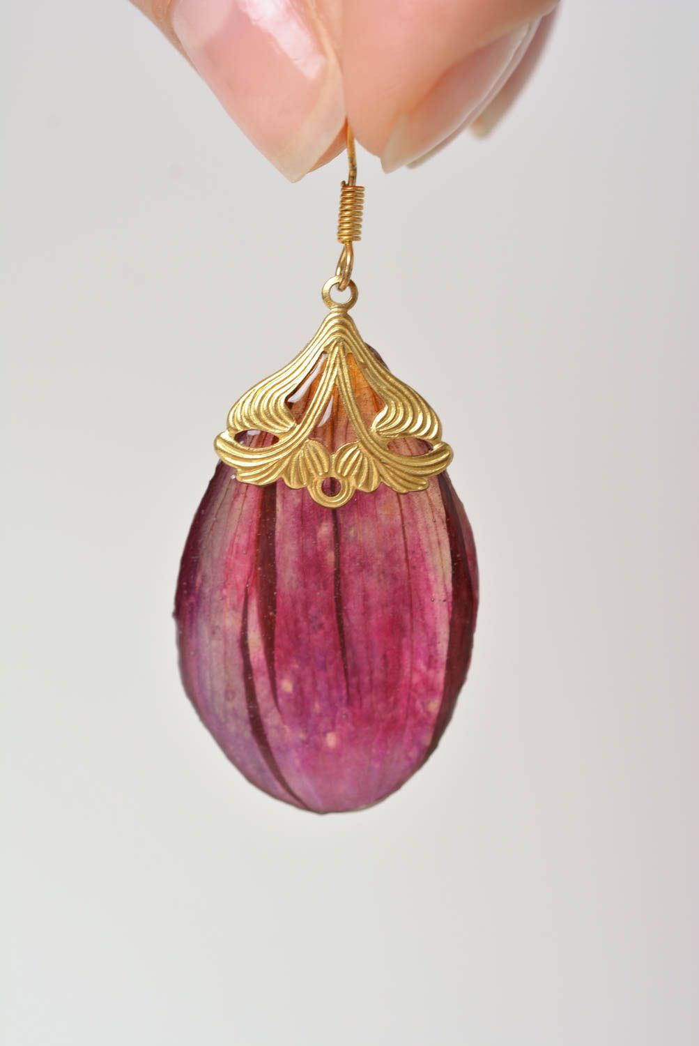 Handmade designer earrings with dark purple flower petals in epoxy resin photo 2