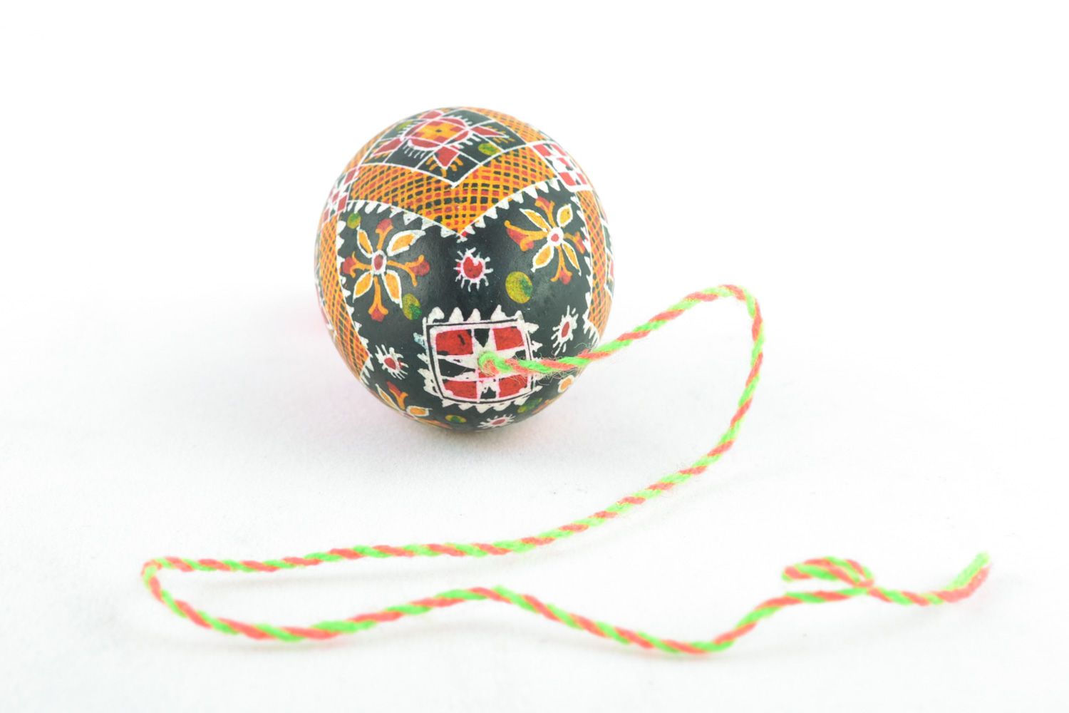 Handmade hanging Easter egg painted with hot wax and decorated with tassel  photo 5