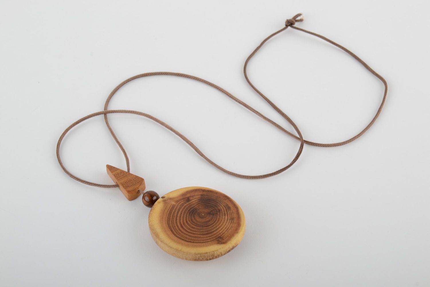 Large handmade varnished wooden neck pendant of oval shape with cord for women photo 4