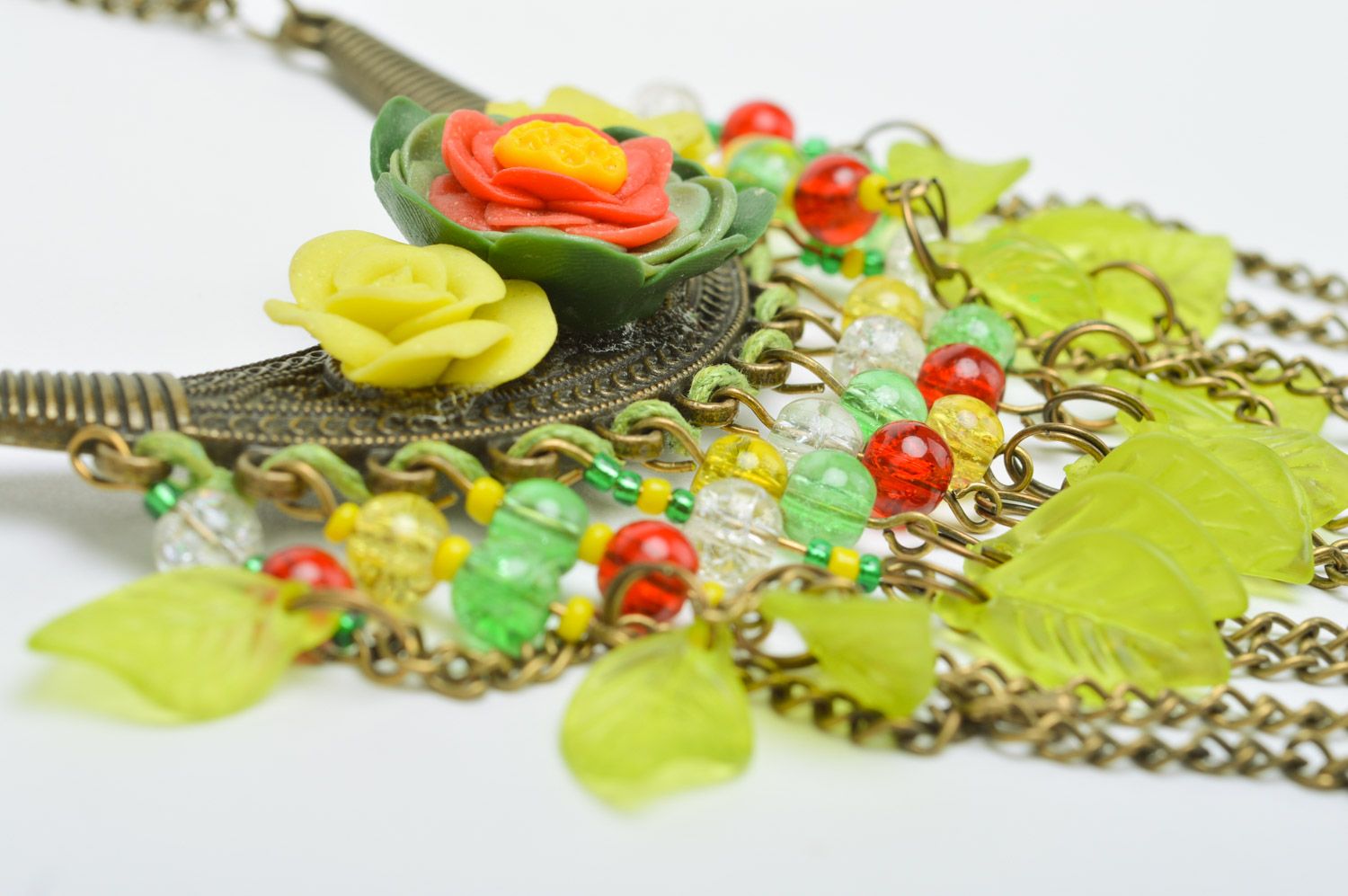 Handmade yellow metal and polymer clay necklace with charms photo 3