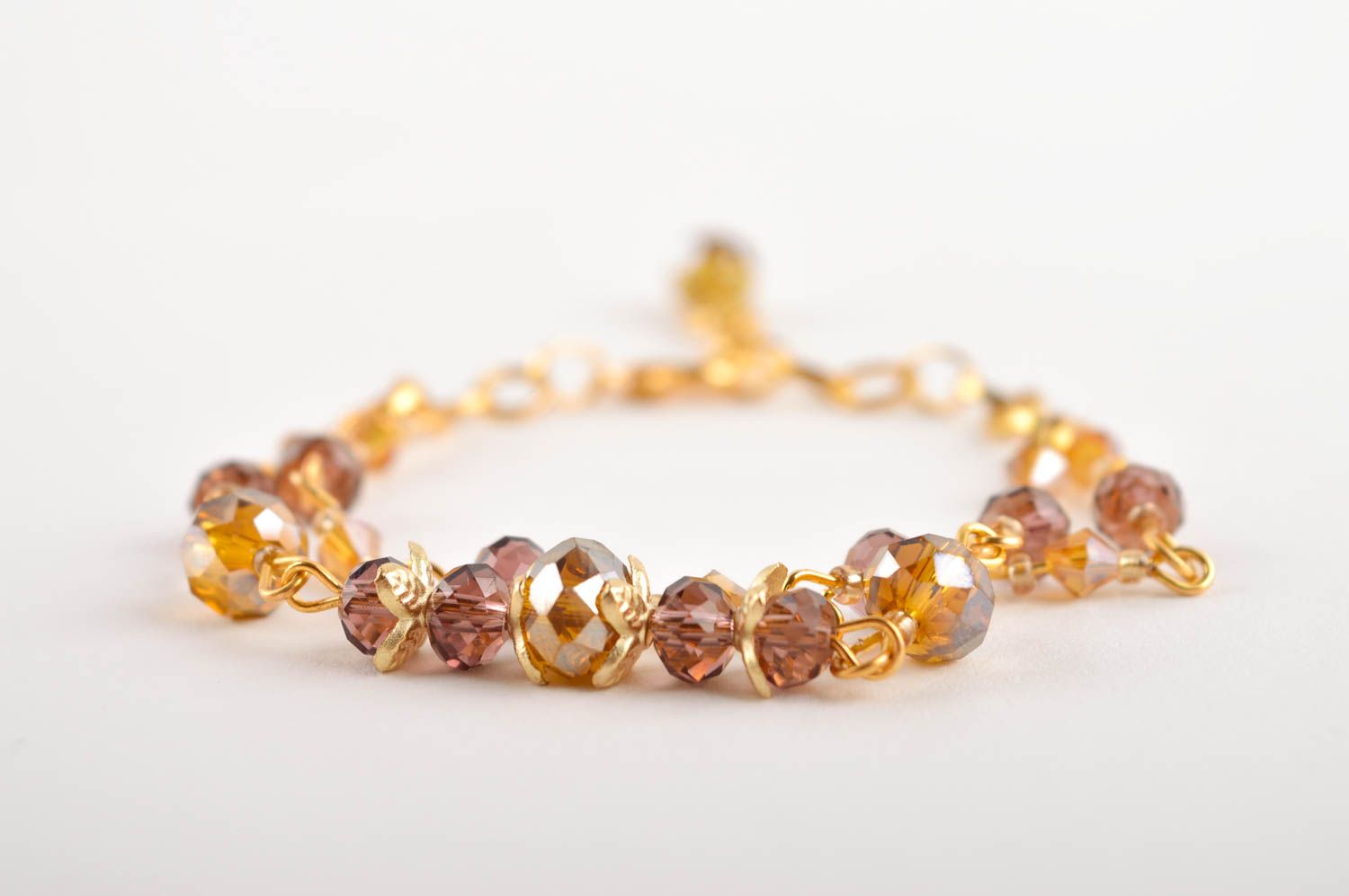 Chain bracelet in golden color with brown beads for girls photo 3