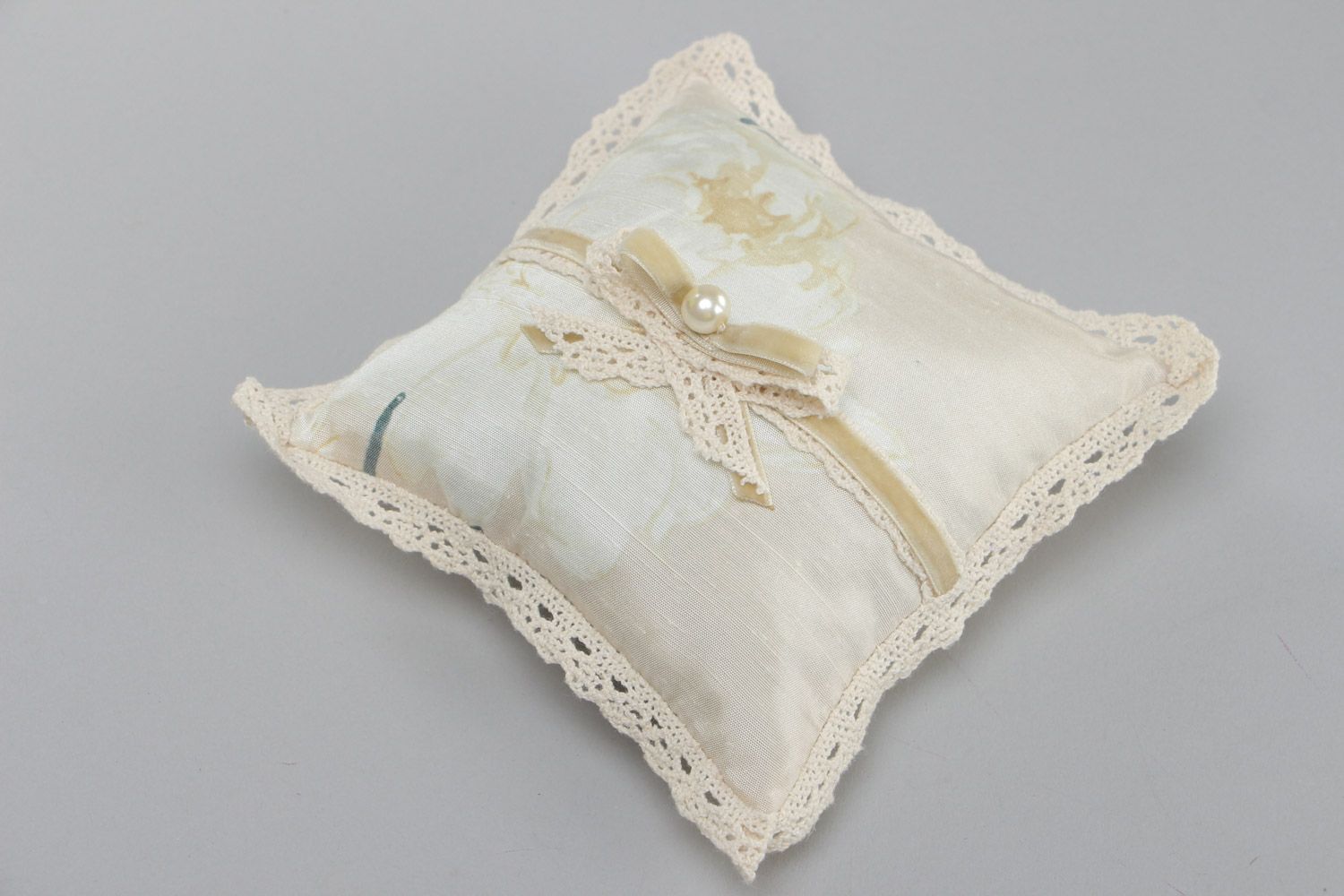 Handmade wedding ring bearer pillow sewn of ivory-colored silk fabric with bow photo 2