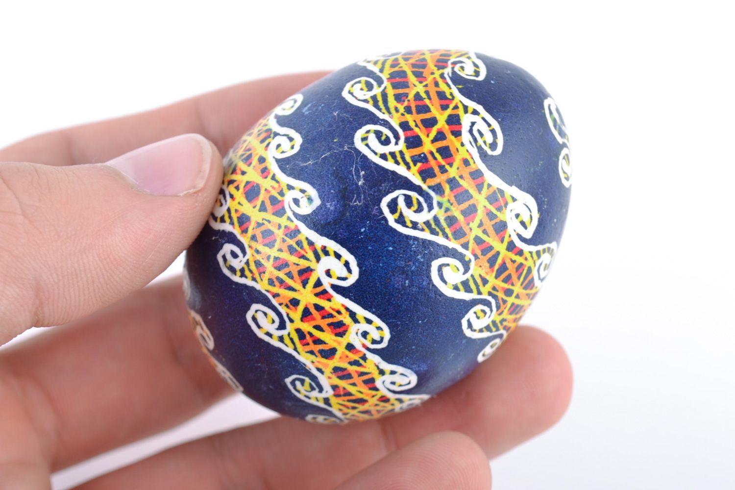 Handmade decorative Easter egg painted with acrylics on blue background photo 2