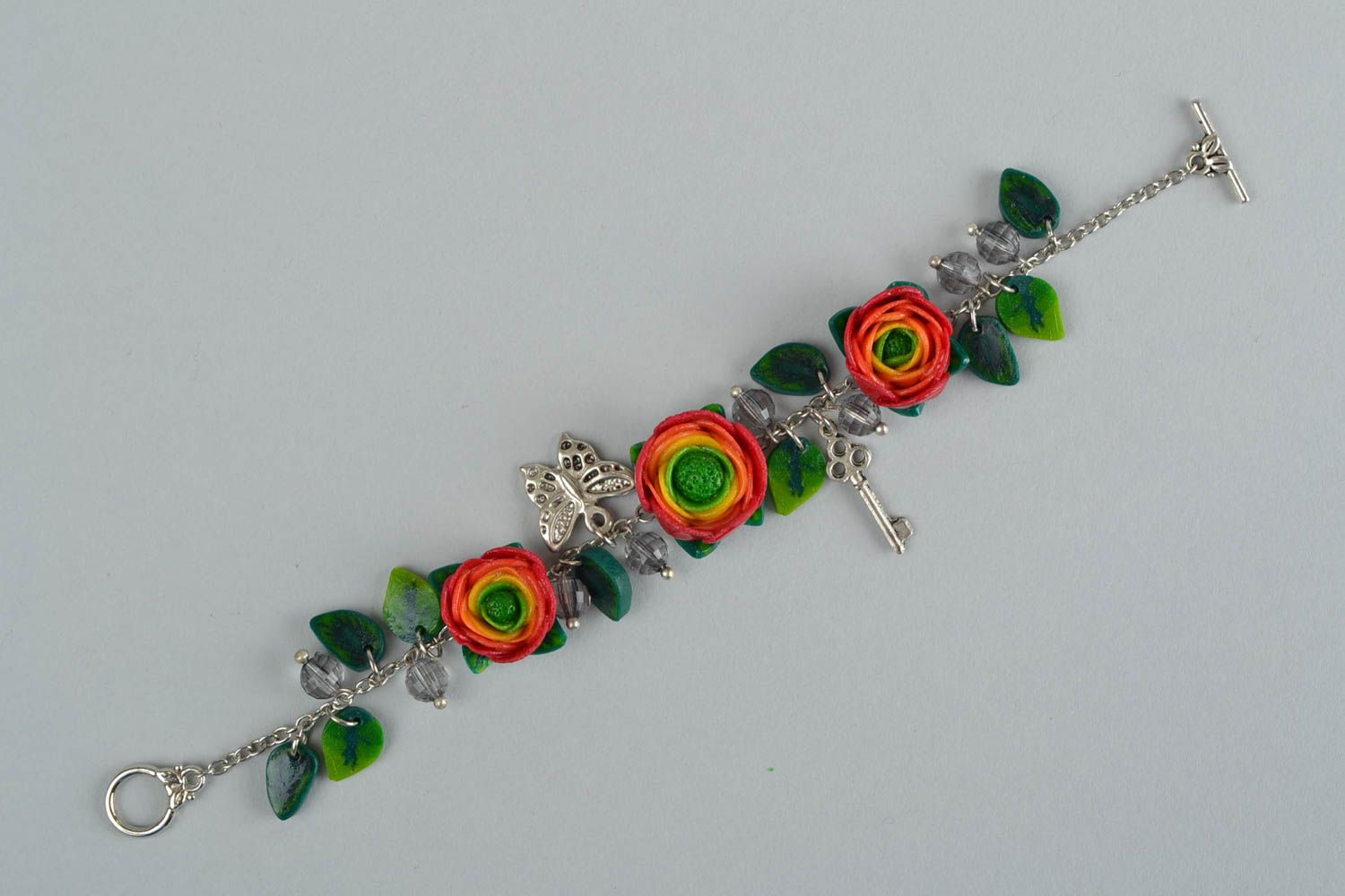 Beautiful women's handmade designer wrist bracelet with plastic flowers photo 4
