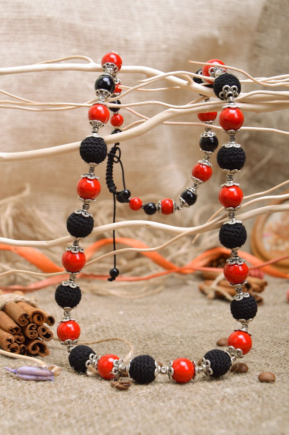Handmade bright long necklace with crochet over beads of red and black colors photo 3