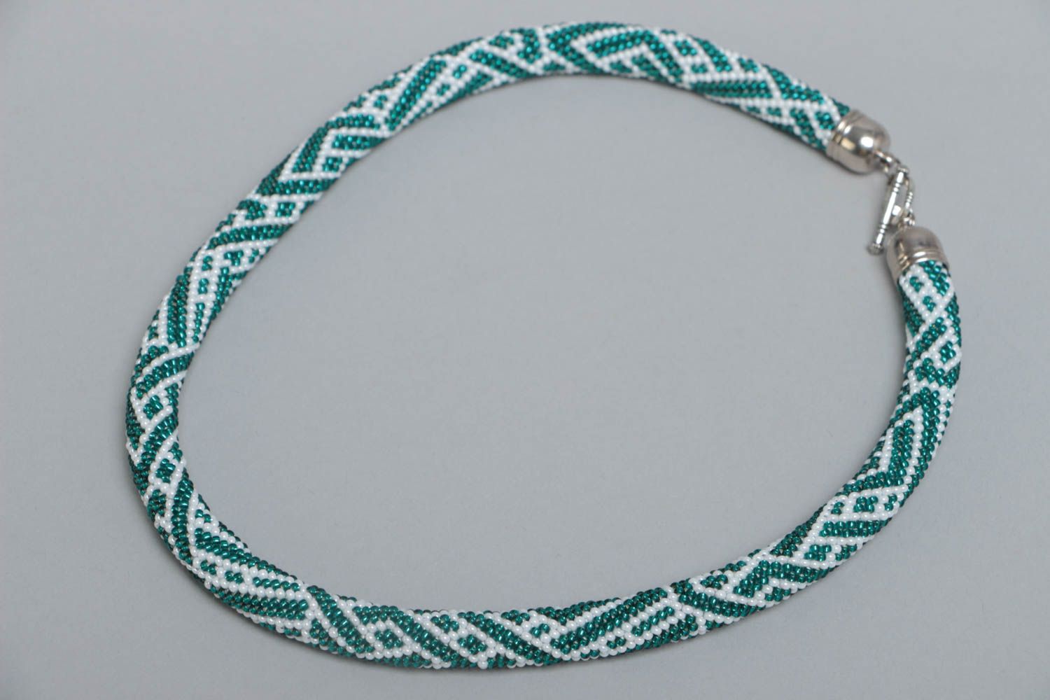Handmade designer beaded cord necklace with white and turquoise colors pattern photo 2