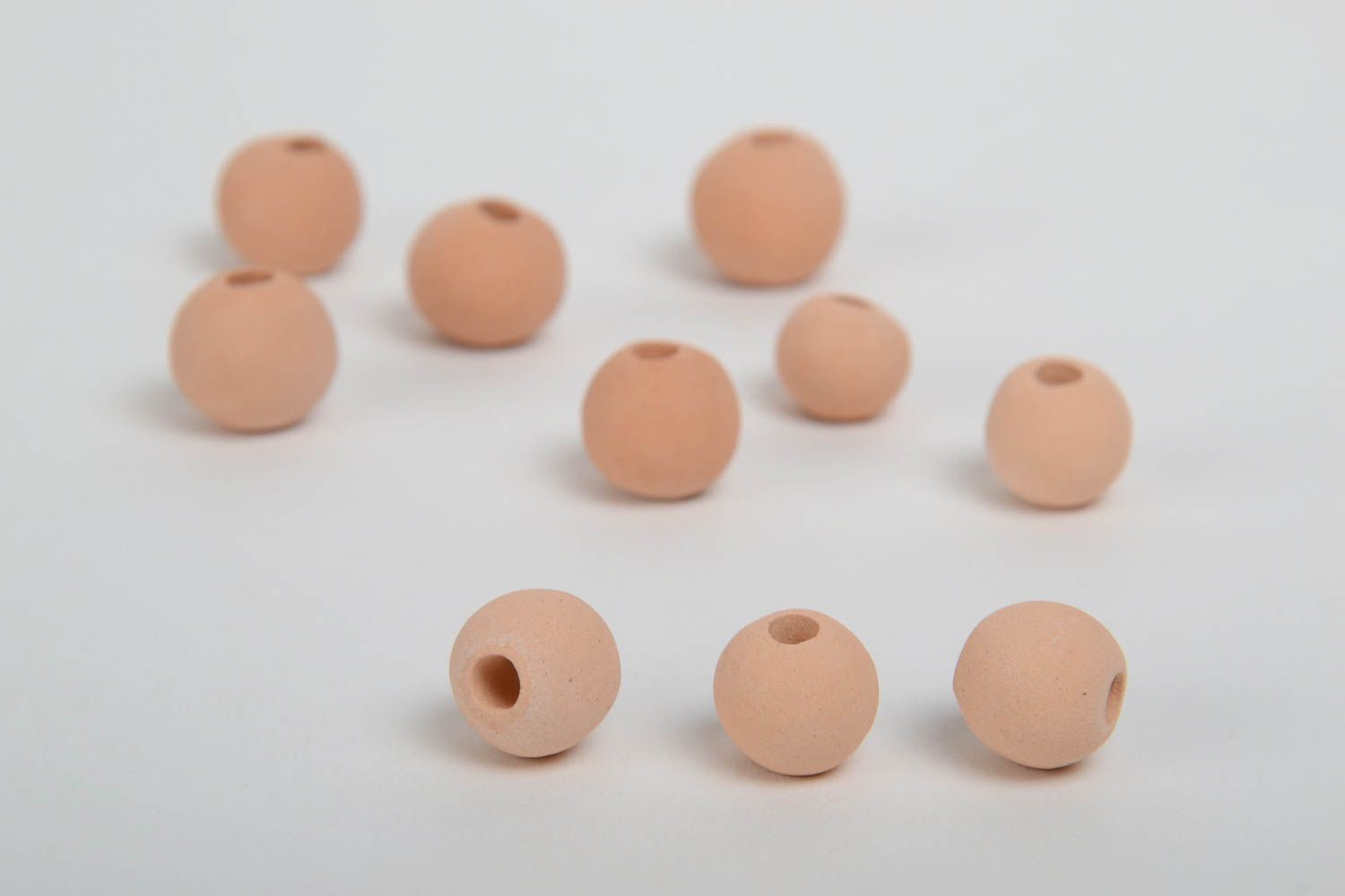 Set of 10 small handmade beige ceramic beads with smooth surface photo 3