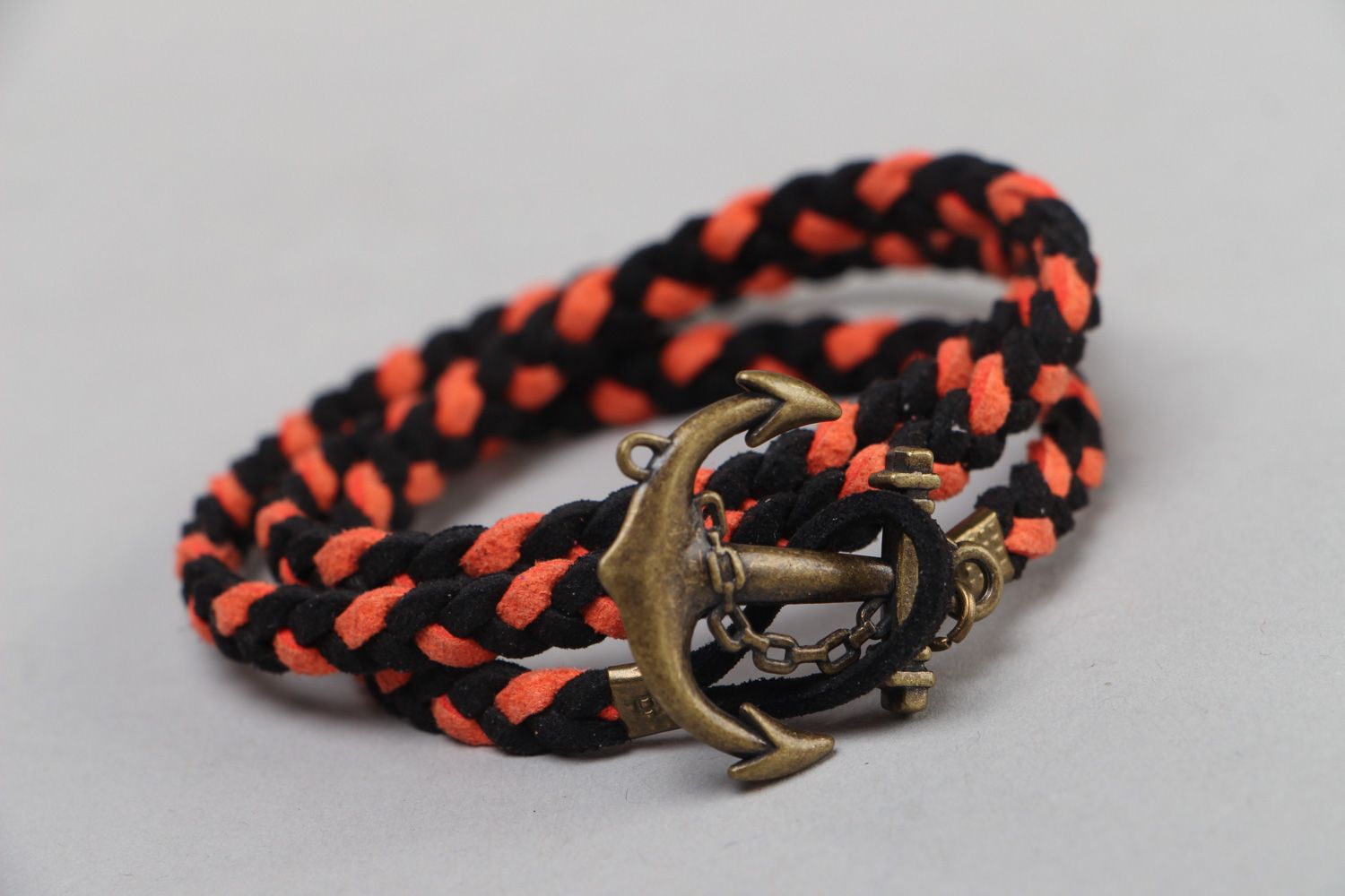 Handmade marine bracelet woven of faux suede cord of black and orange colors photo 1