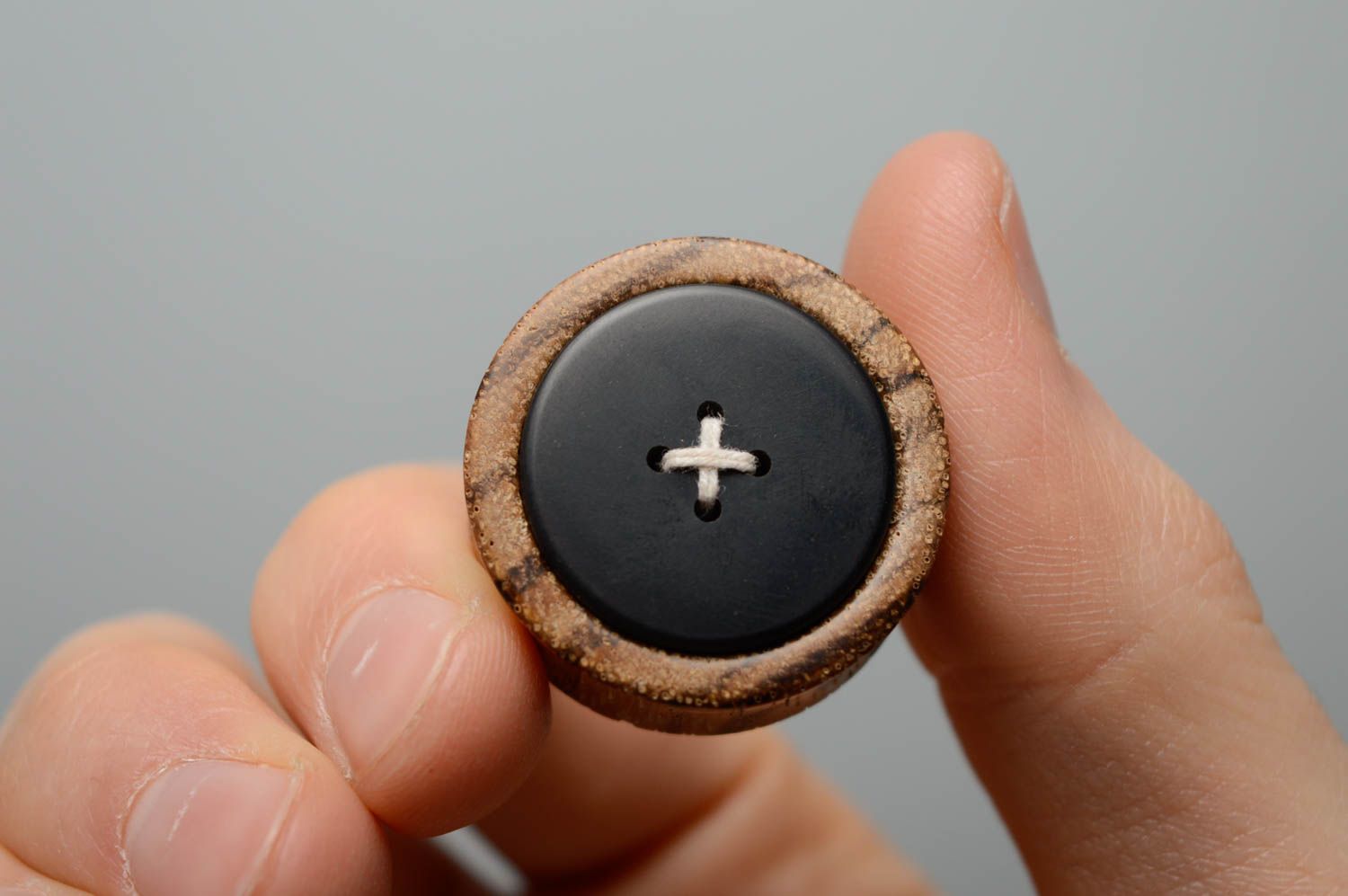 Unusual wooden ear plugs in the shape of buttons photo 4