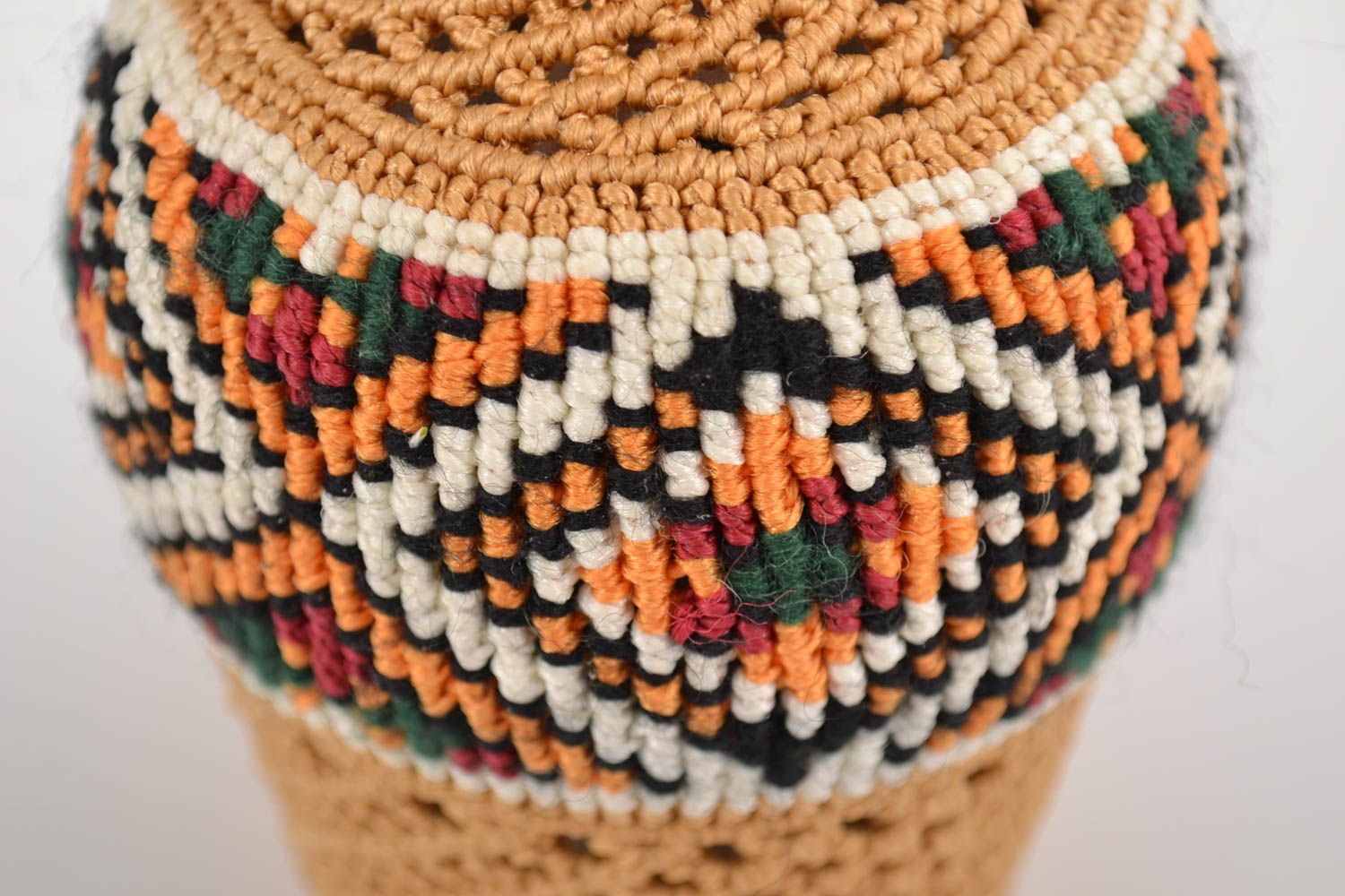 Handmade decorative glass bottle woven over with threads using macrame technique photo 2