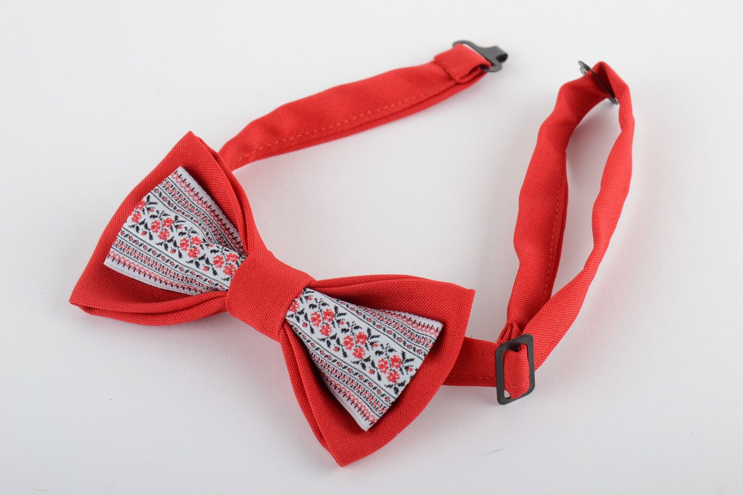 Handmade designer bow tie sewn of red and patterned fabrics in ethnic style photo 2