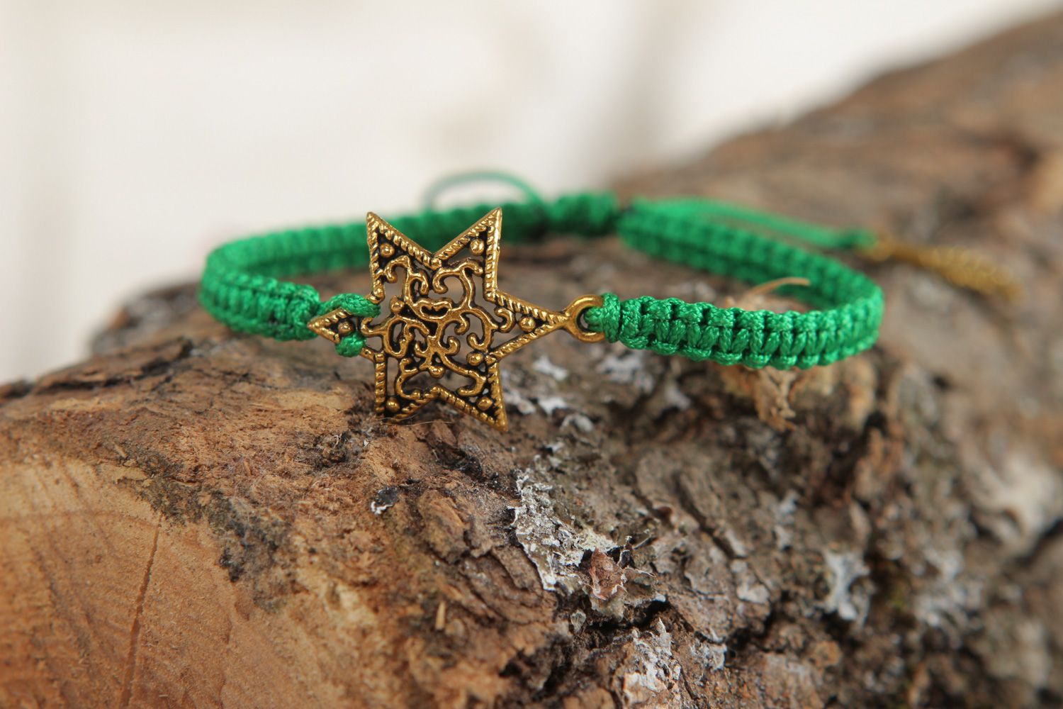 Handmade friendship bracelet woven of green cord with metal star for girls photo 4