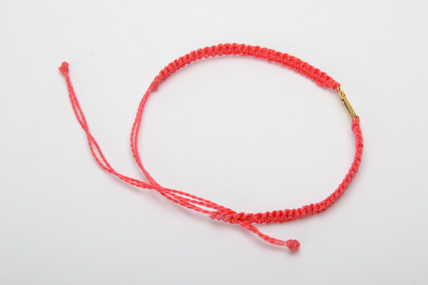 Handmade women's woven thread bracelet of red color with metal pin charm photo 4