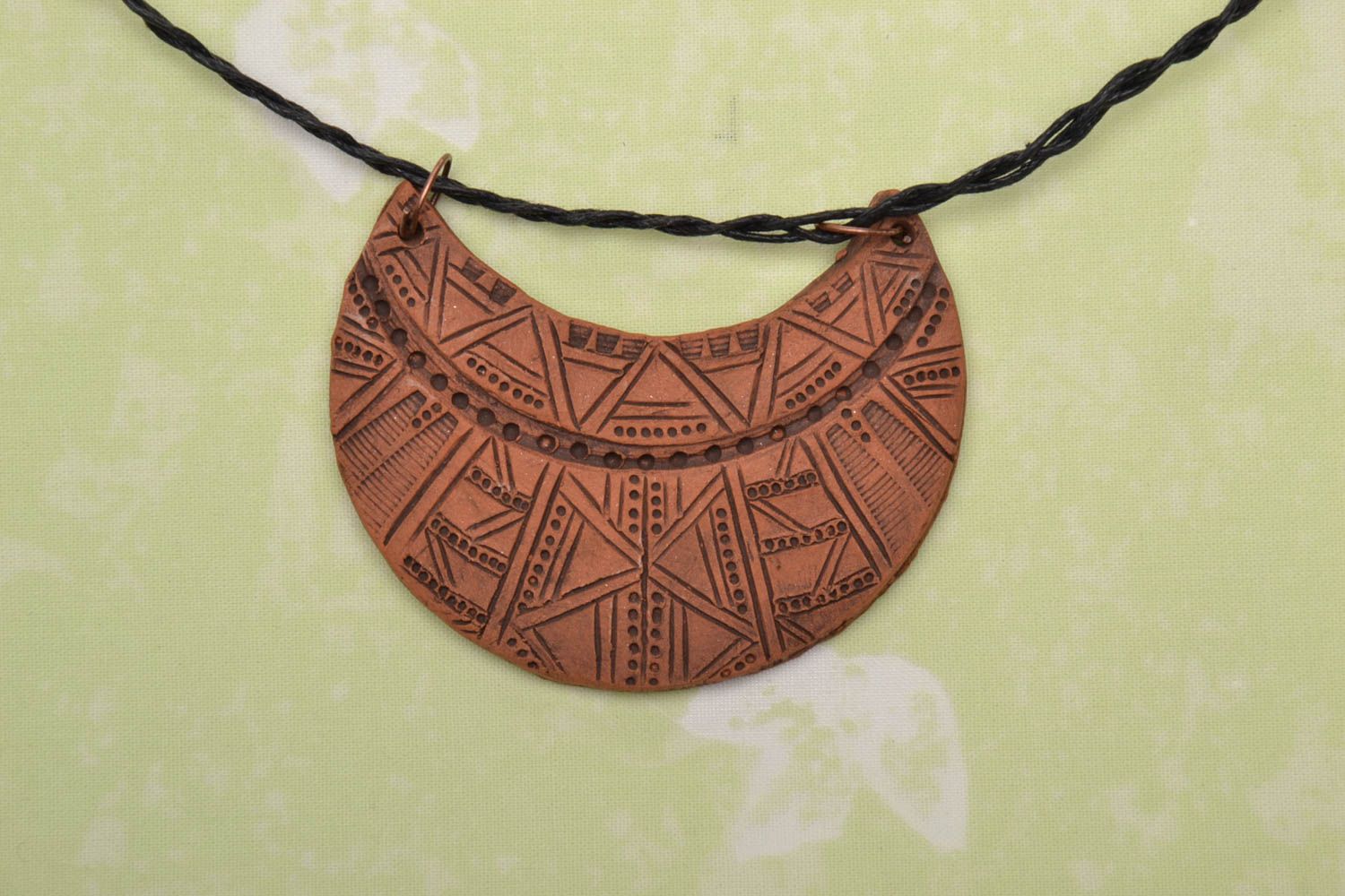 Ceramic half-moon pendant with beautiful patterns photo 1