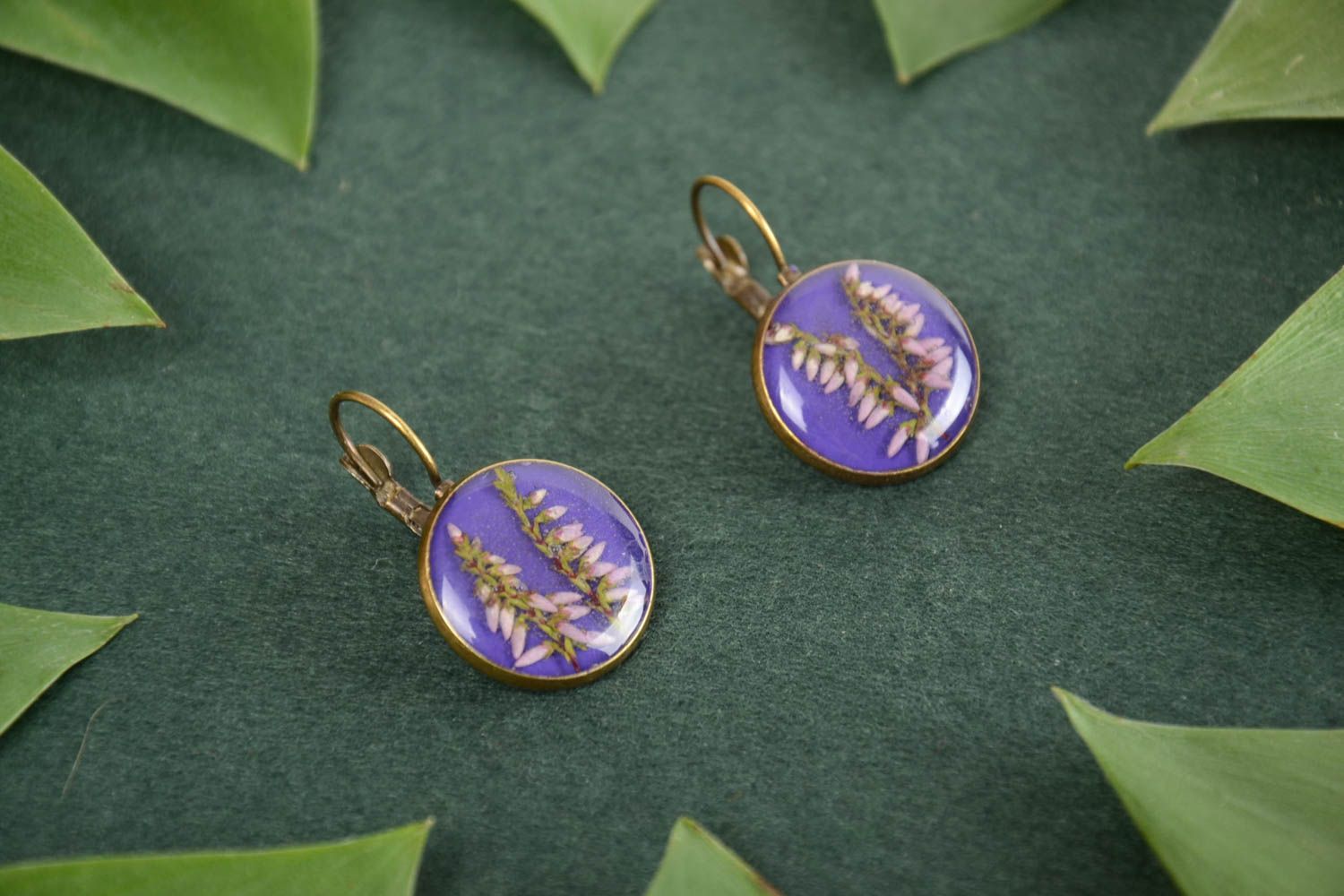 Nice handmade round epoxy resin earrings of lilac color with living plants photo 1
