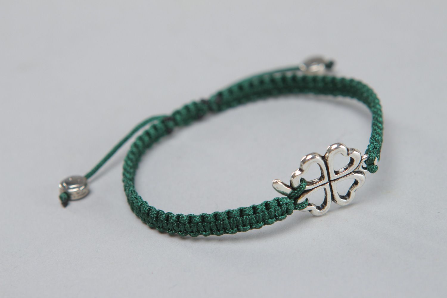Handmade friendship bracelet woven of green threads with metal insert for women photo 1