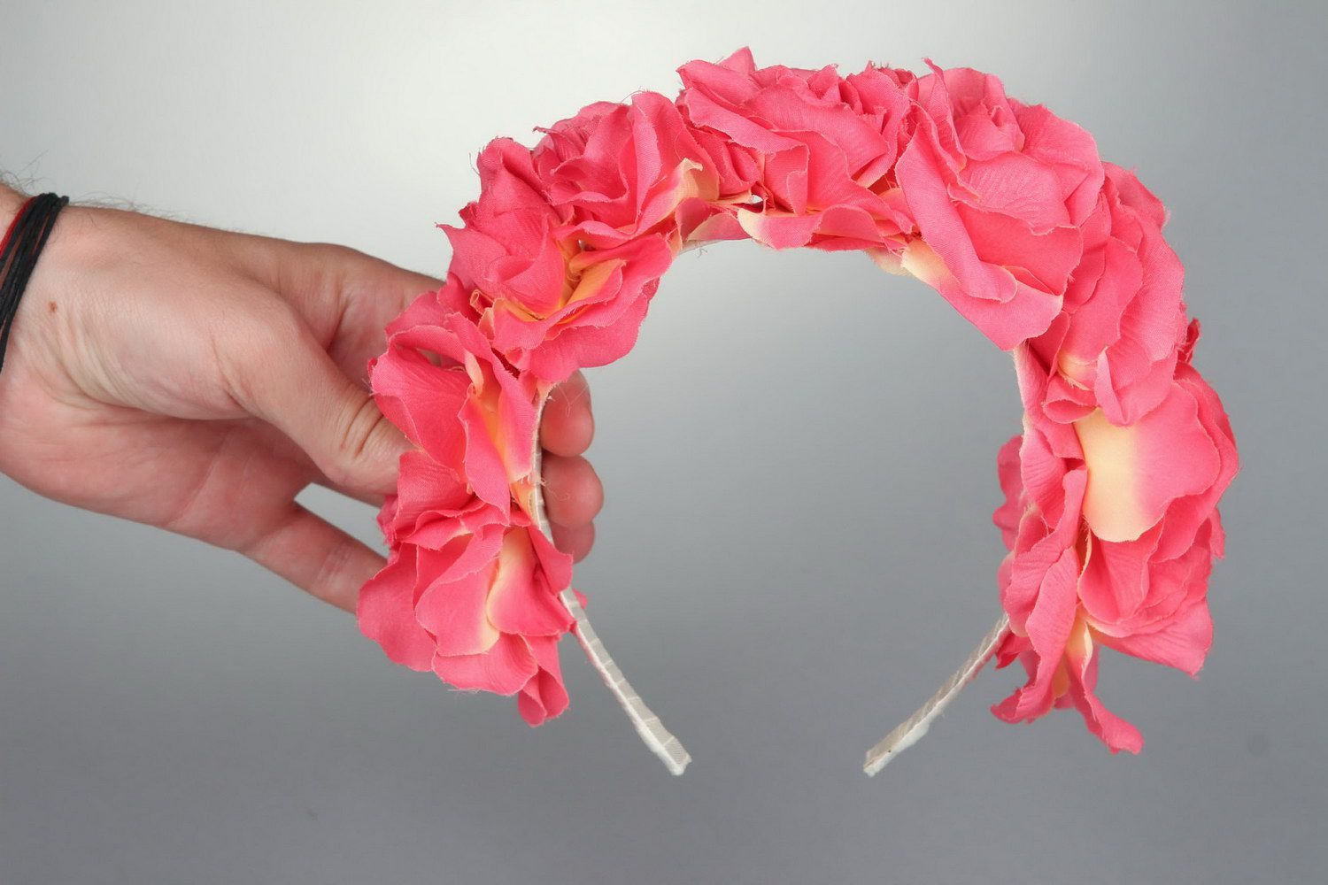 Pink wreath made of fabric flowers photo 3