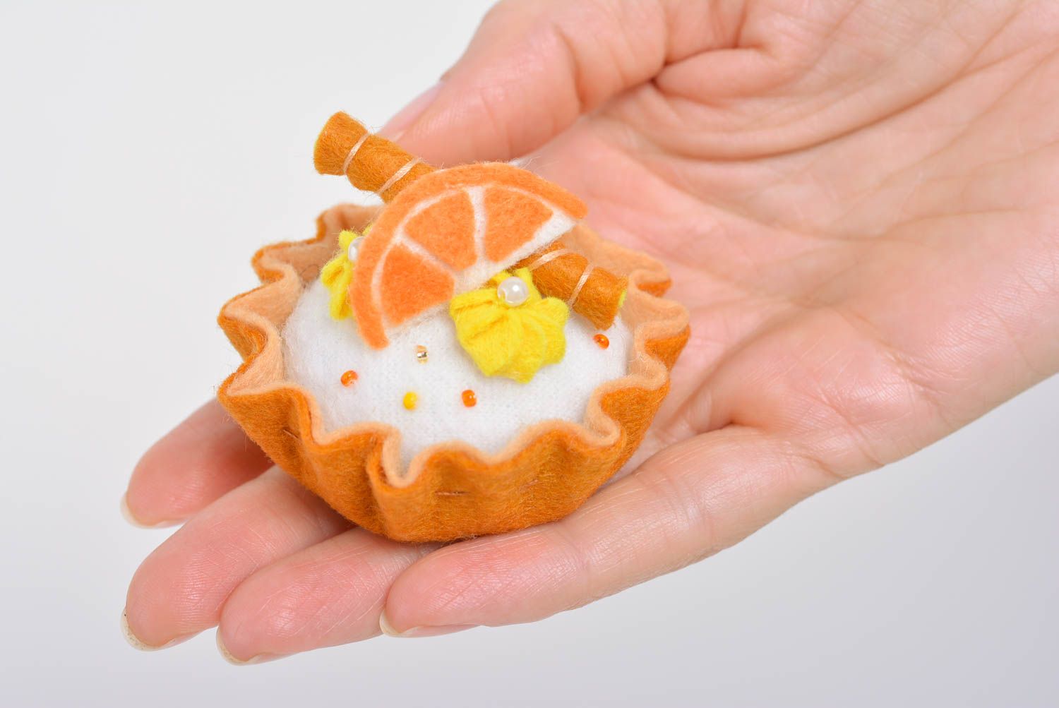 Handmade designer decorative soft pincushion sewn of felt bright orange cake photo 5