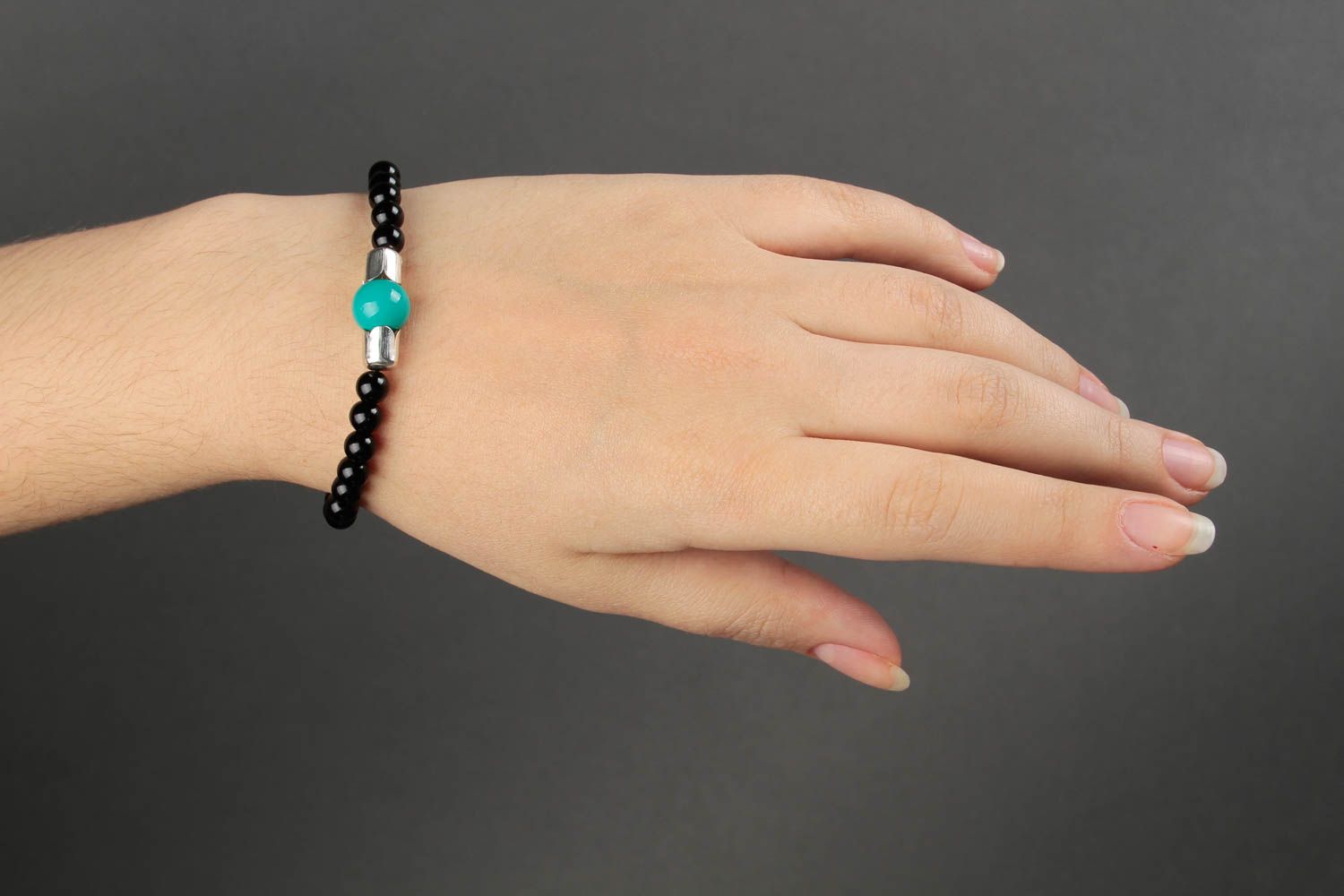 Black beads bracelet on elastic cord and center malachite bead. Unisex bracelet photo 1