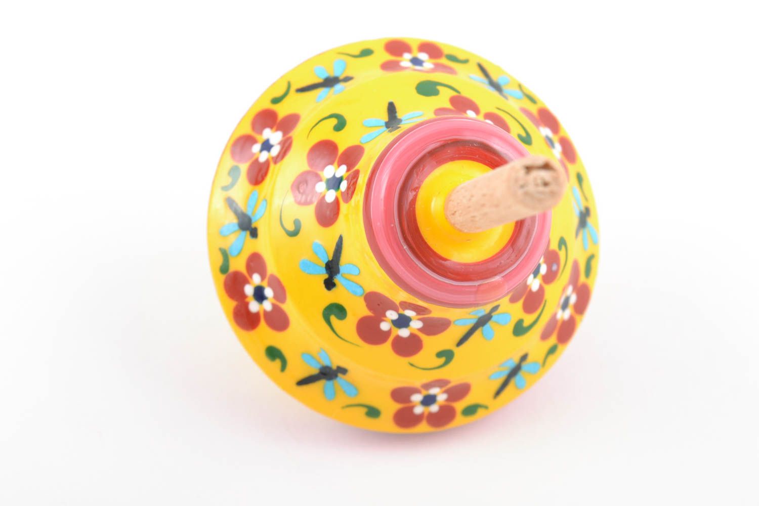 Small painted yellow handmade wooden toy spinning top for children photo 3
