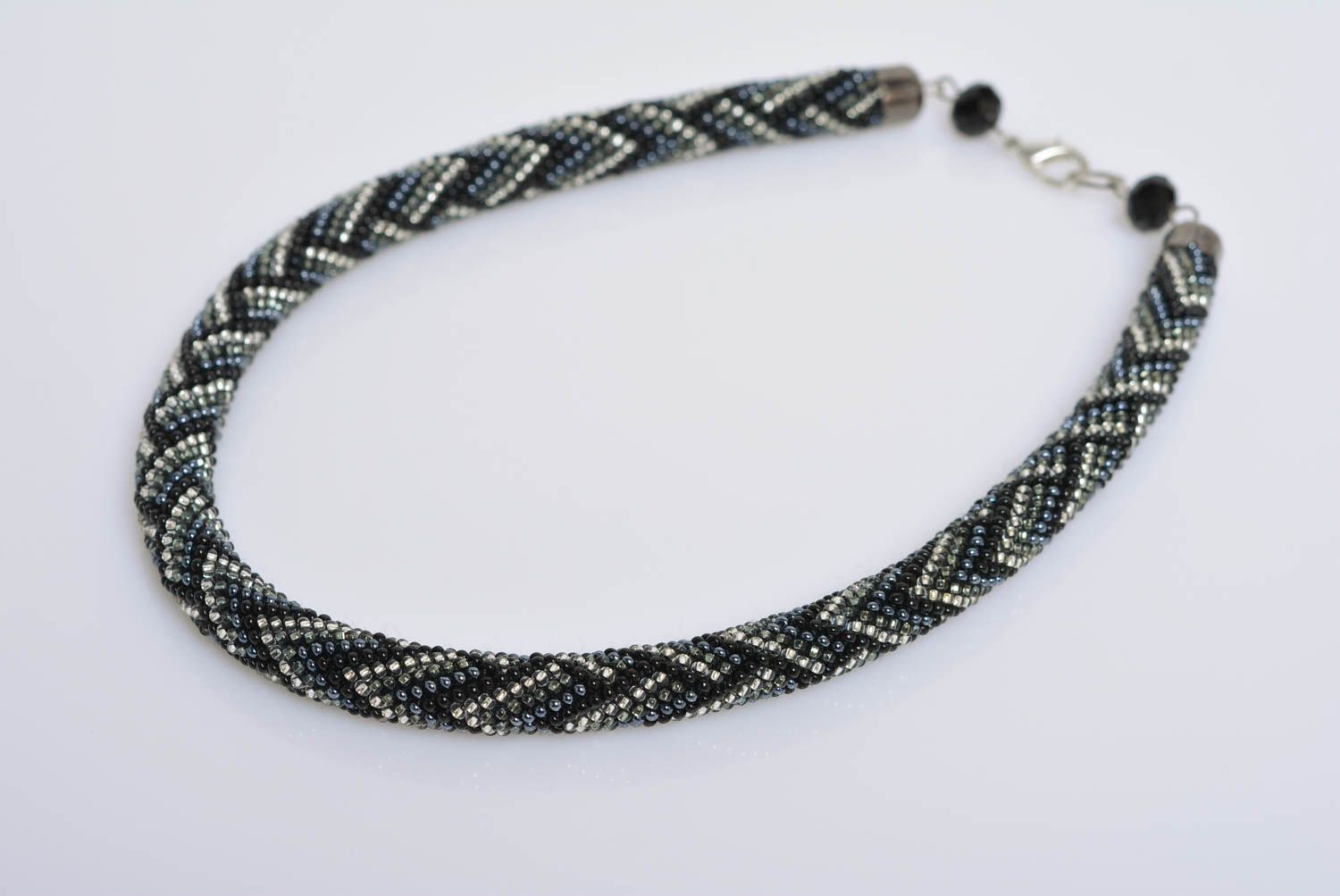 Handmade designer bead woven cord necklace with laconic dark geometric ornament photo 1