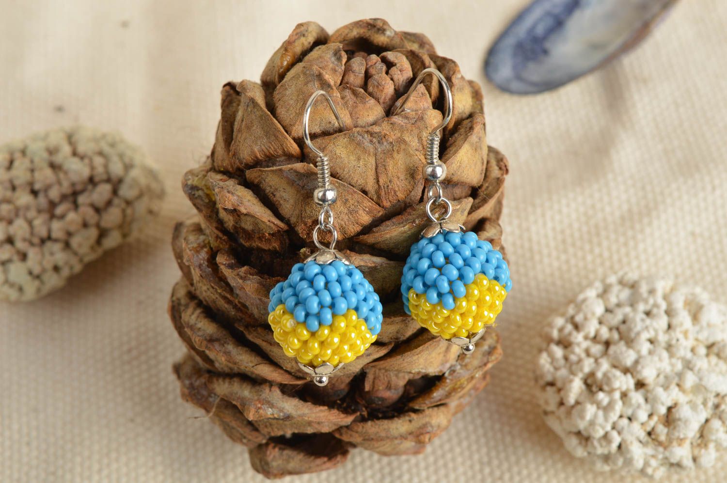 Handmade ball shaped dangle earrings woven of blue and yellow Czech beads photo 1