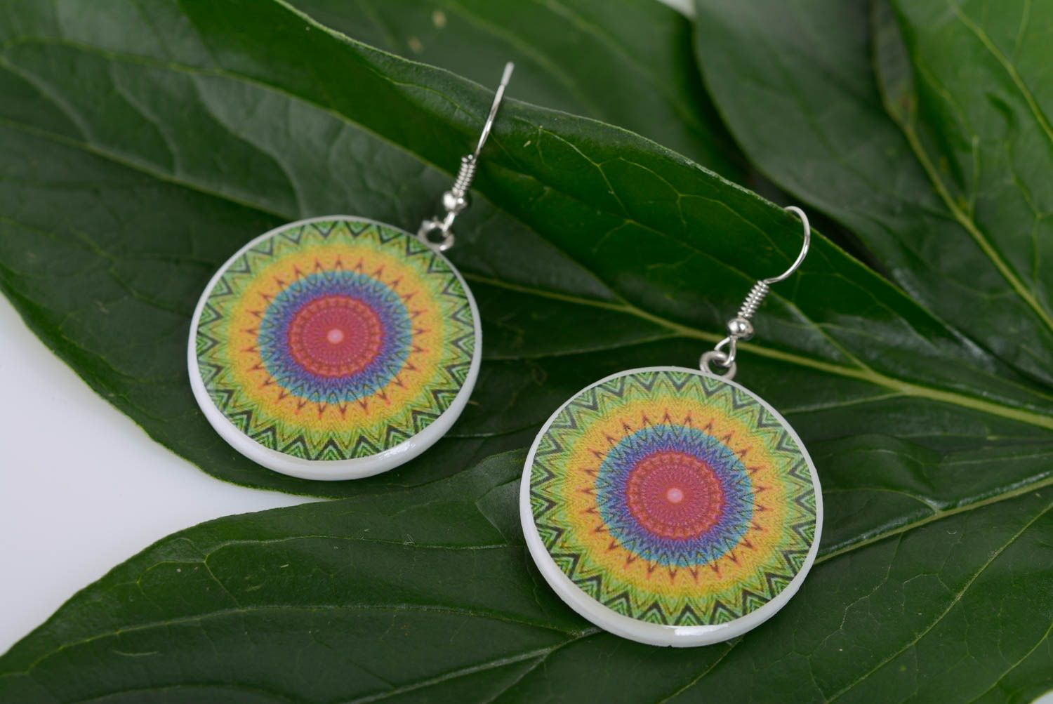 Bright round earrings made of polymer clay with an ornament decoupage technique photo 3