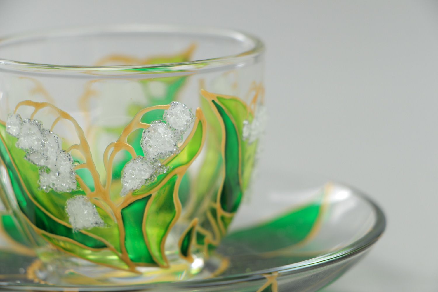 Unique clear glass teacup with hand-painted gold and green floral pattern photo 3