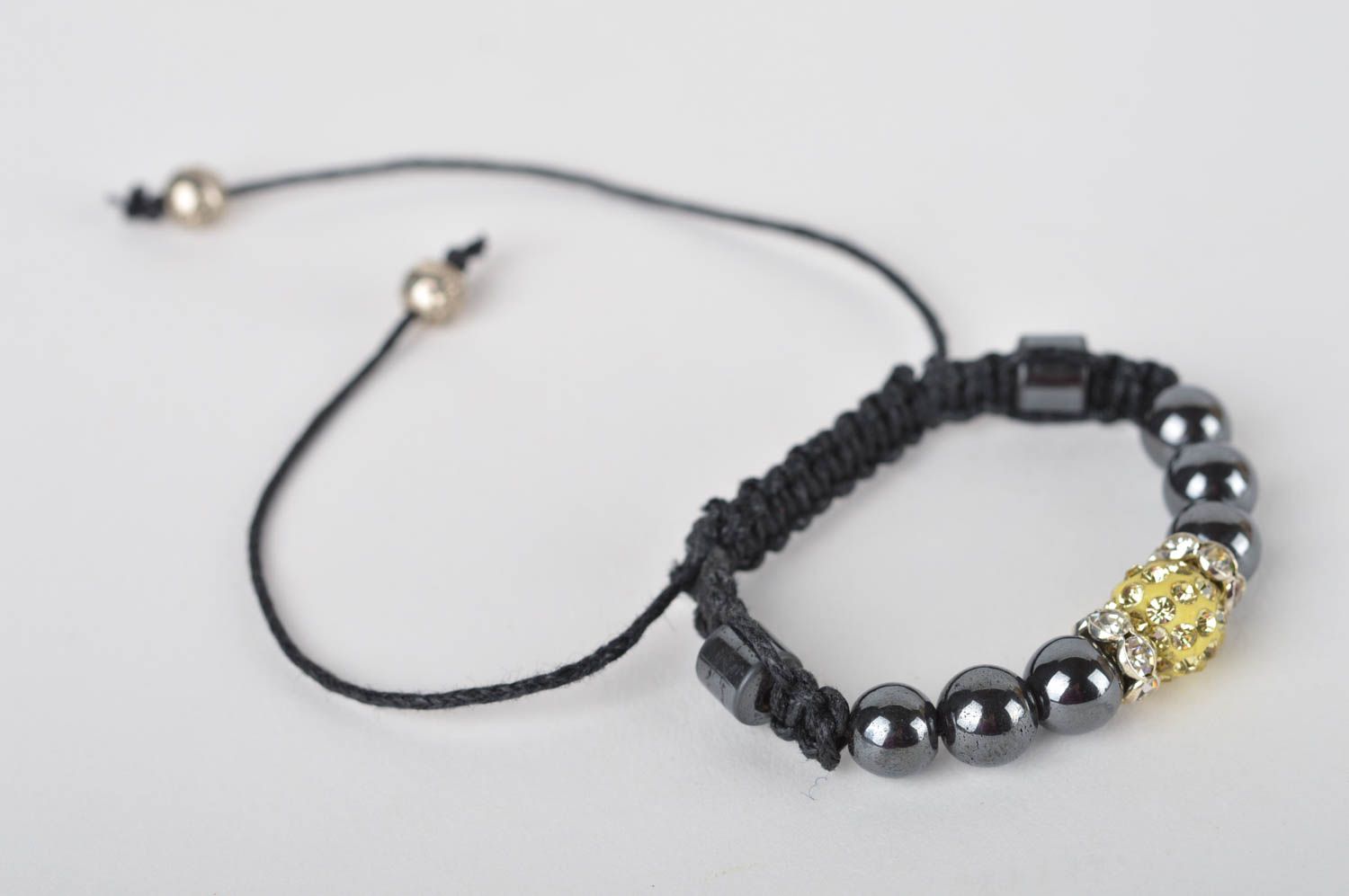 Handmade black beads strand bracelet on black cord with golden centerpiece for women photo 2