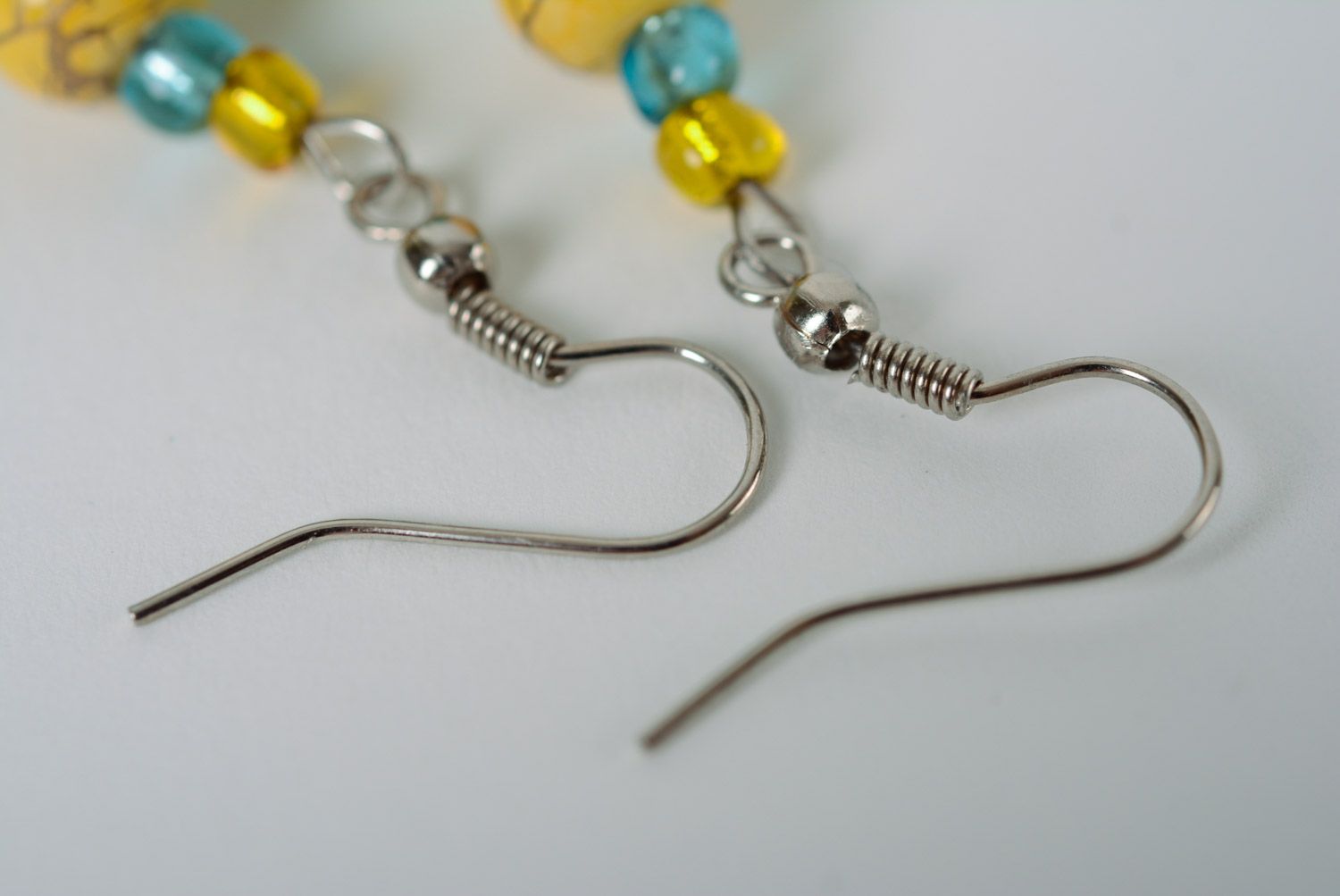 Handmade beaded earrings crocheted over with yellow and blue cotton threads photo 3