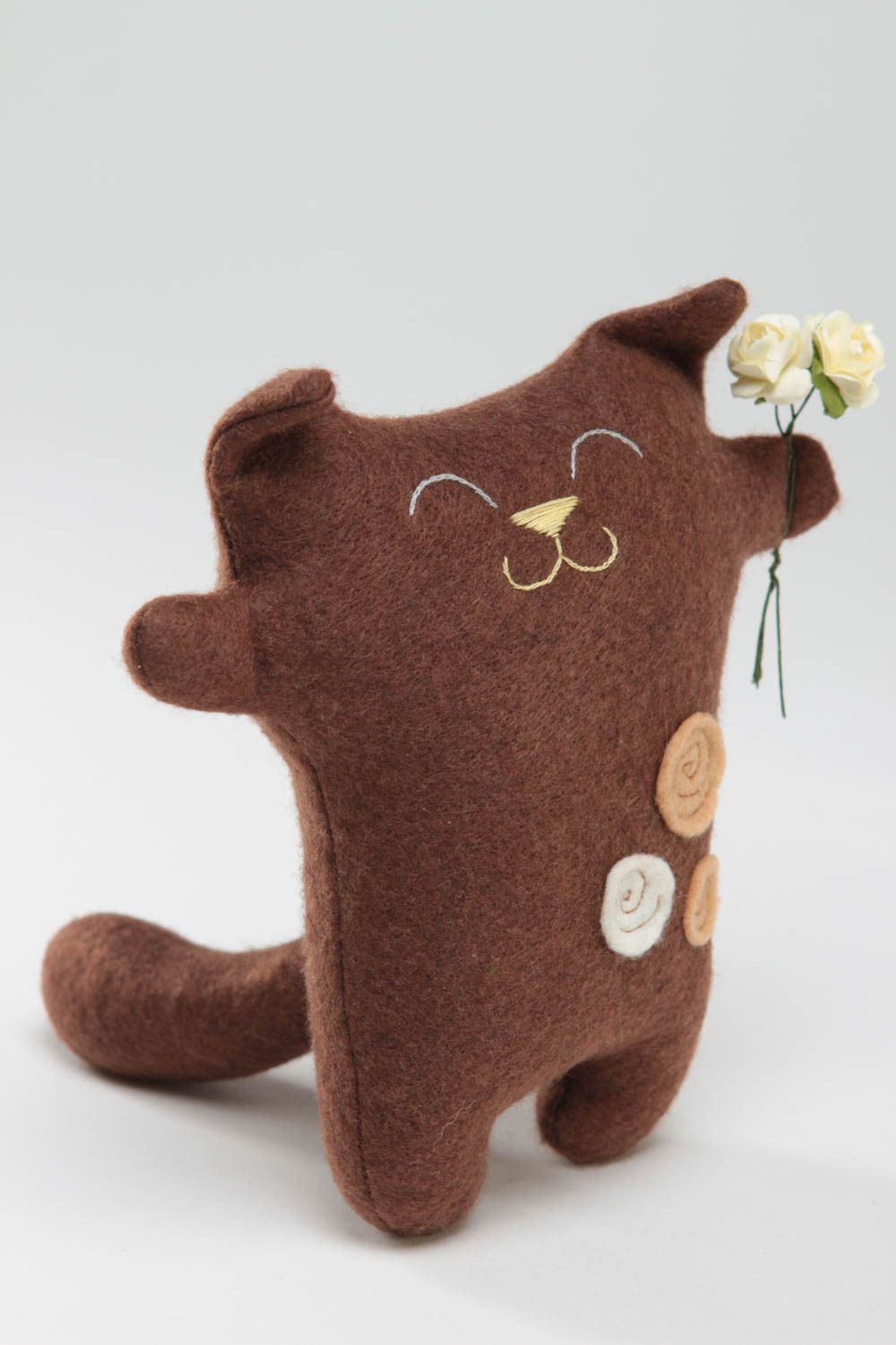 Handmade brown soft small toy made of felt in shape of cat with flowers photo 2