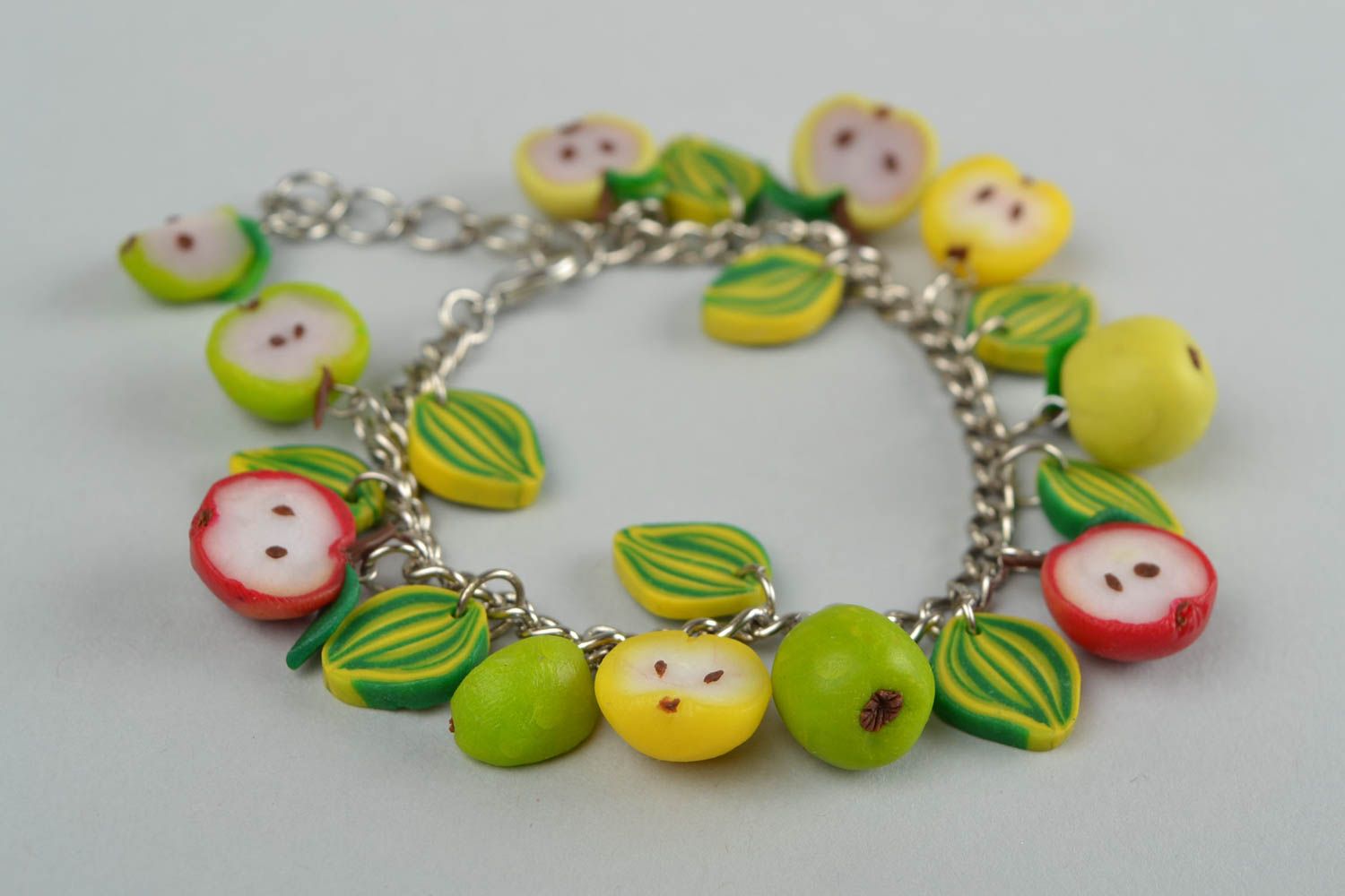 Handmade green designer wrist bracelet with fruit made of polymer clay  photo 1