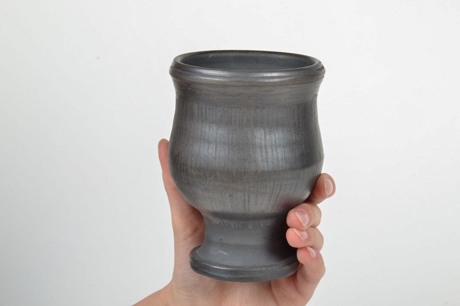 Wine goblet in black color on the stand without a handle. Great natural clay gift. photo 5