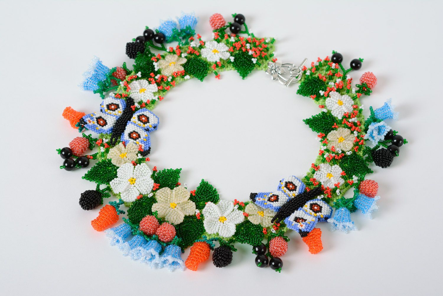 Massive colorful handmade necklace woven of beads with flowers and berries  photo 2