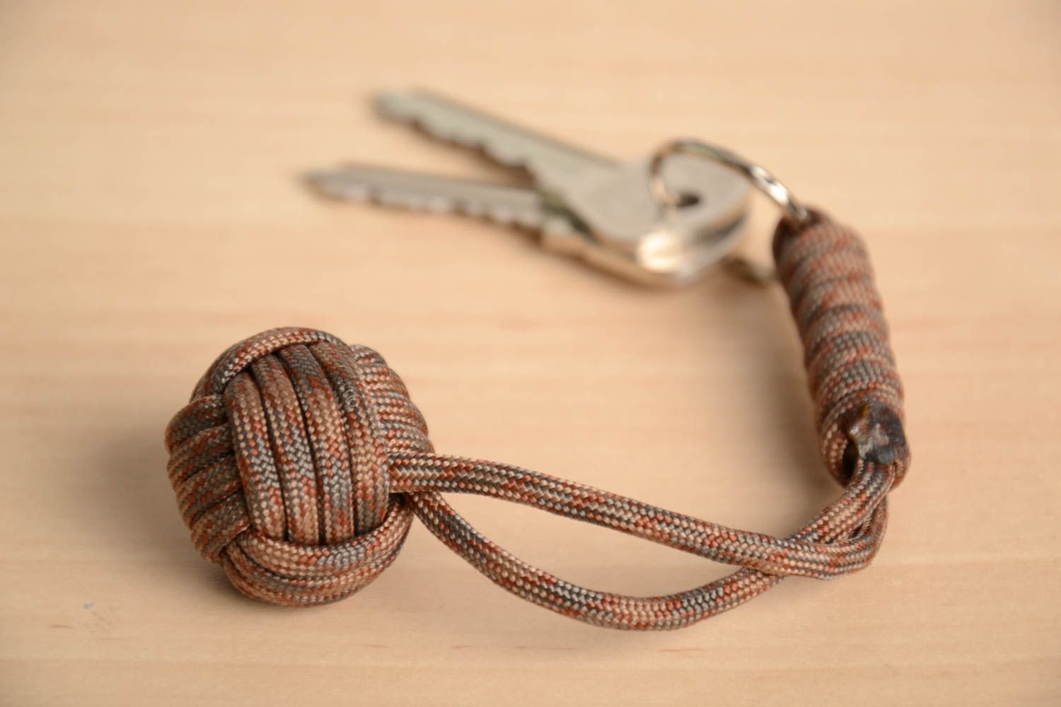Men's brown handmade keychain woven of American paracord photo 1