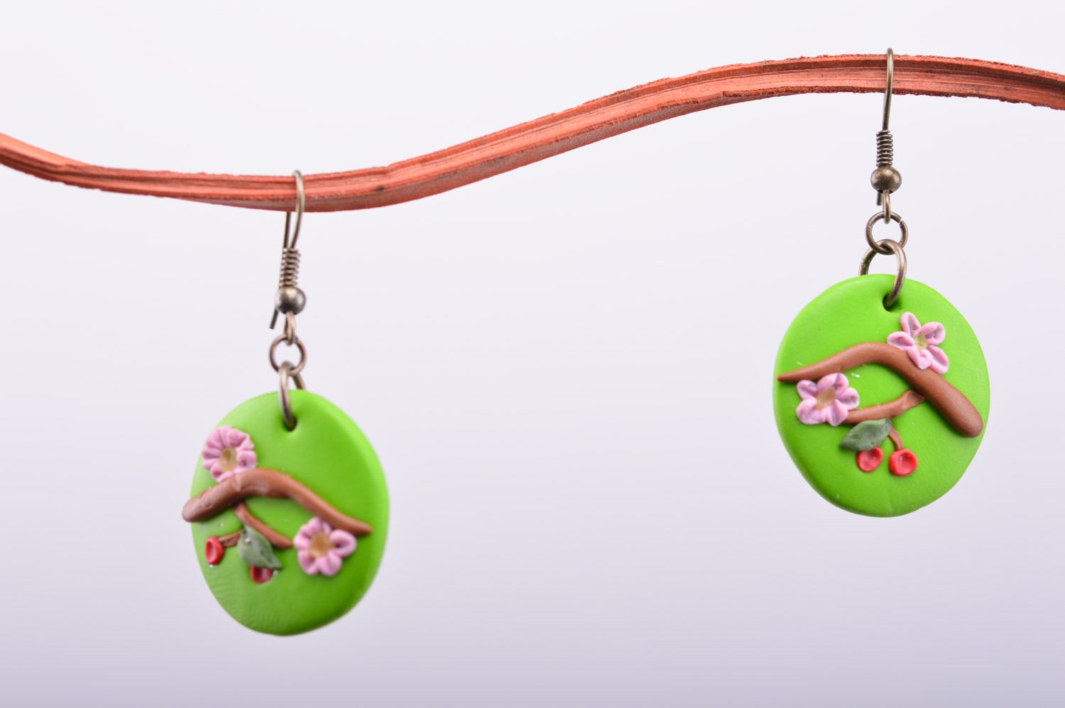 Beautiful handmade polymer clay round earrings of green color Oriental Cherry Branch photo 2