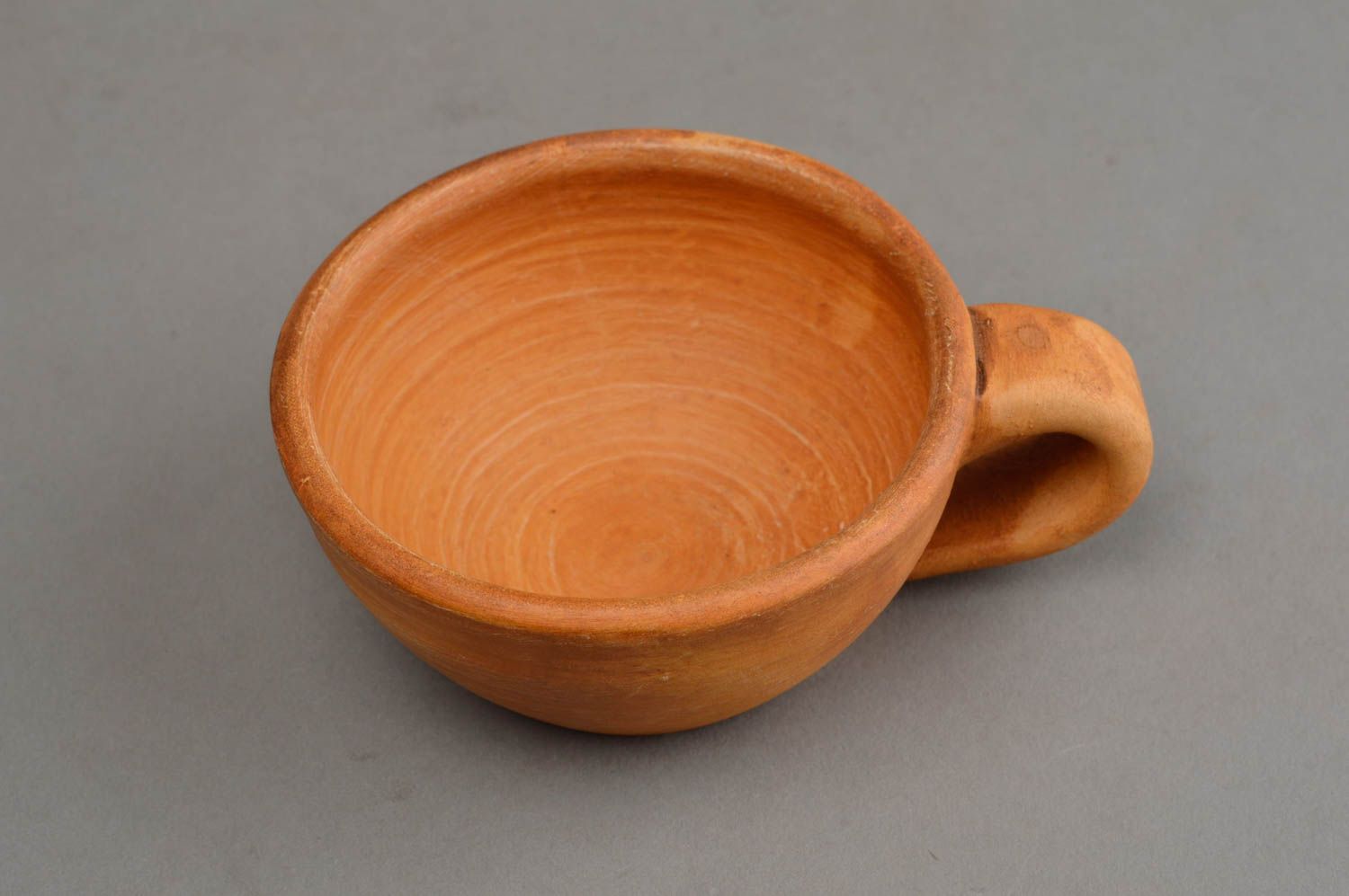 Low wide clay terracotta Mexican-style te cup molded of natural clay photo 3