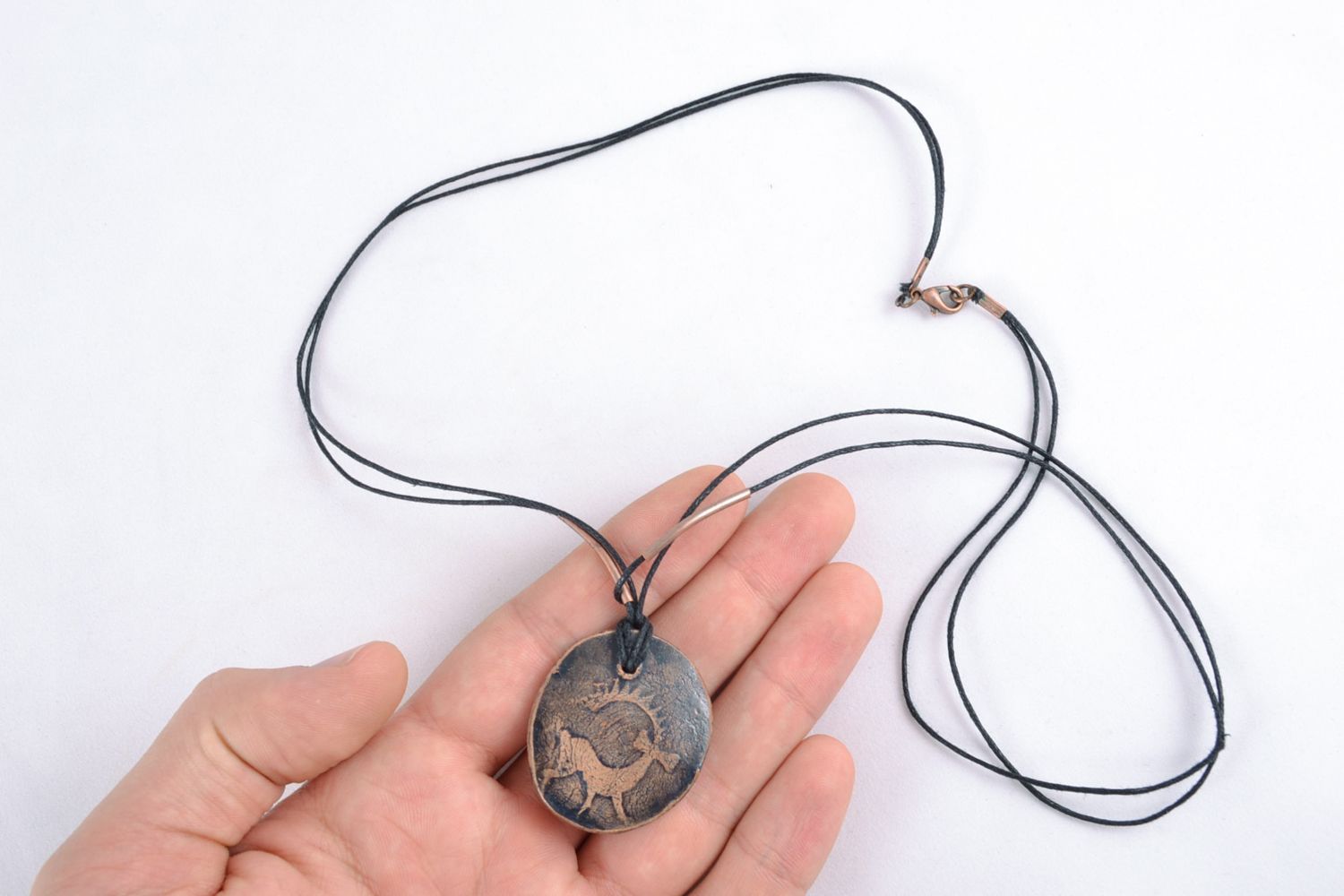 Clay pendant in ethic style with ornament with deer photo 2