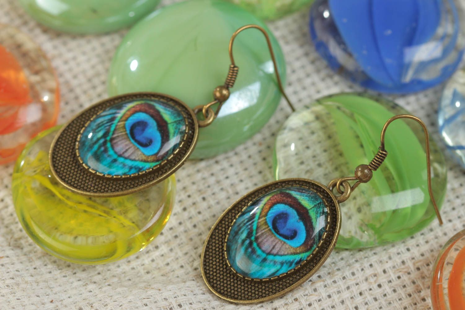 Handmade oval vintage earrings with a beautiful peafowl eye print made of glass glaze photo 1