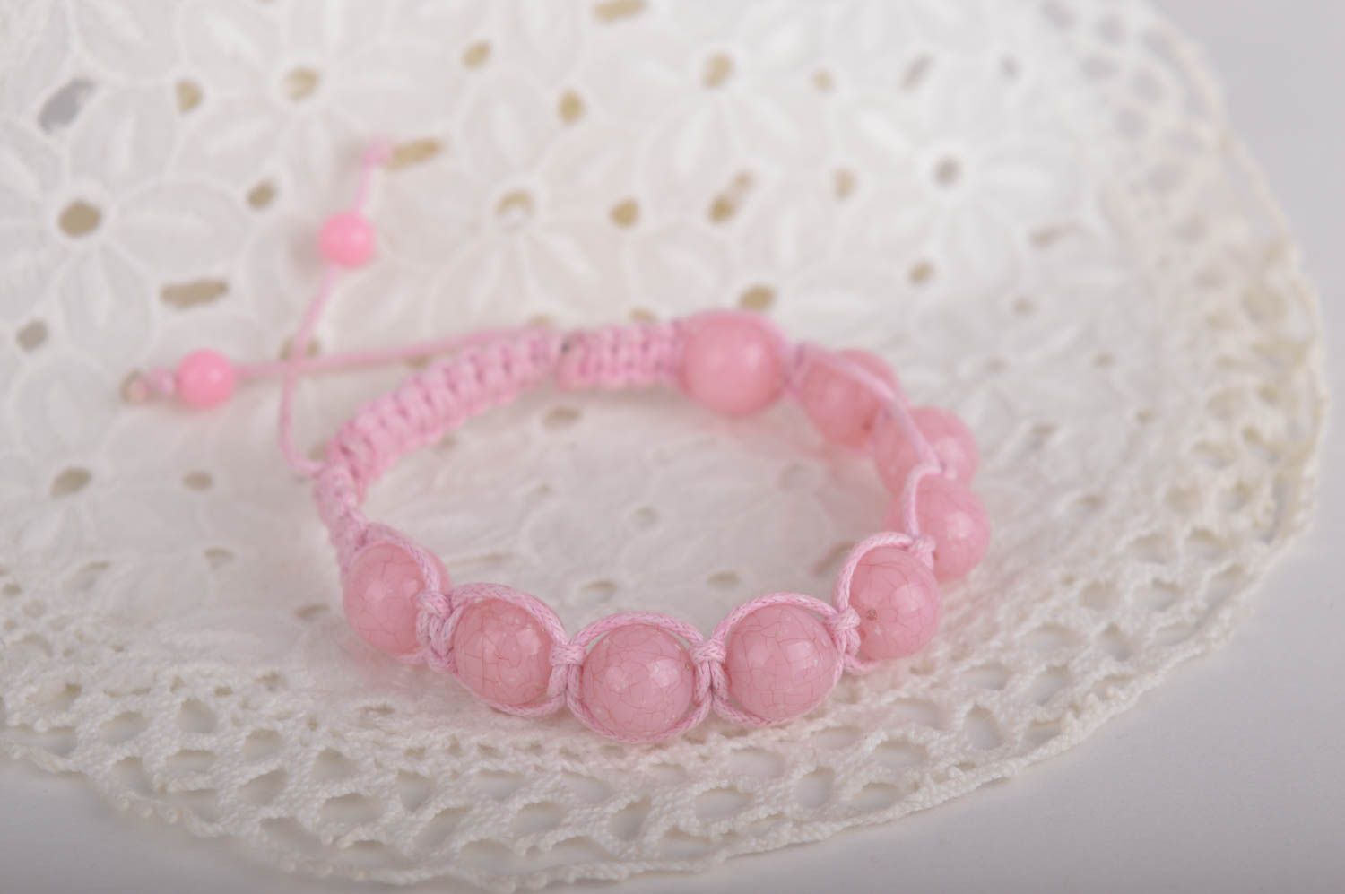 Light pink strand bracelet with pink cord and pink beads photo 2